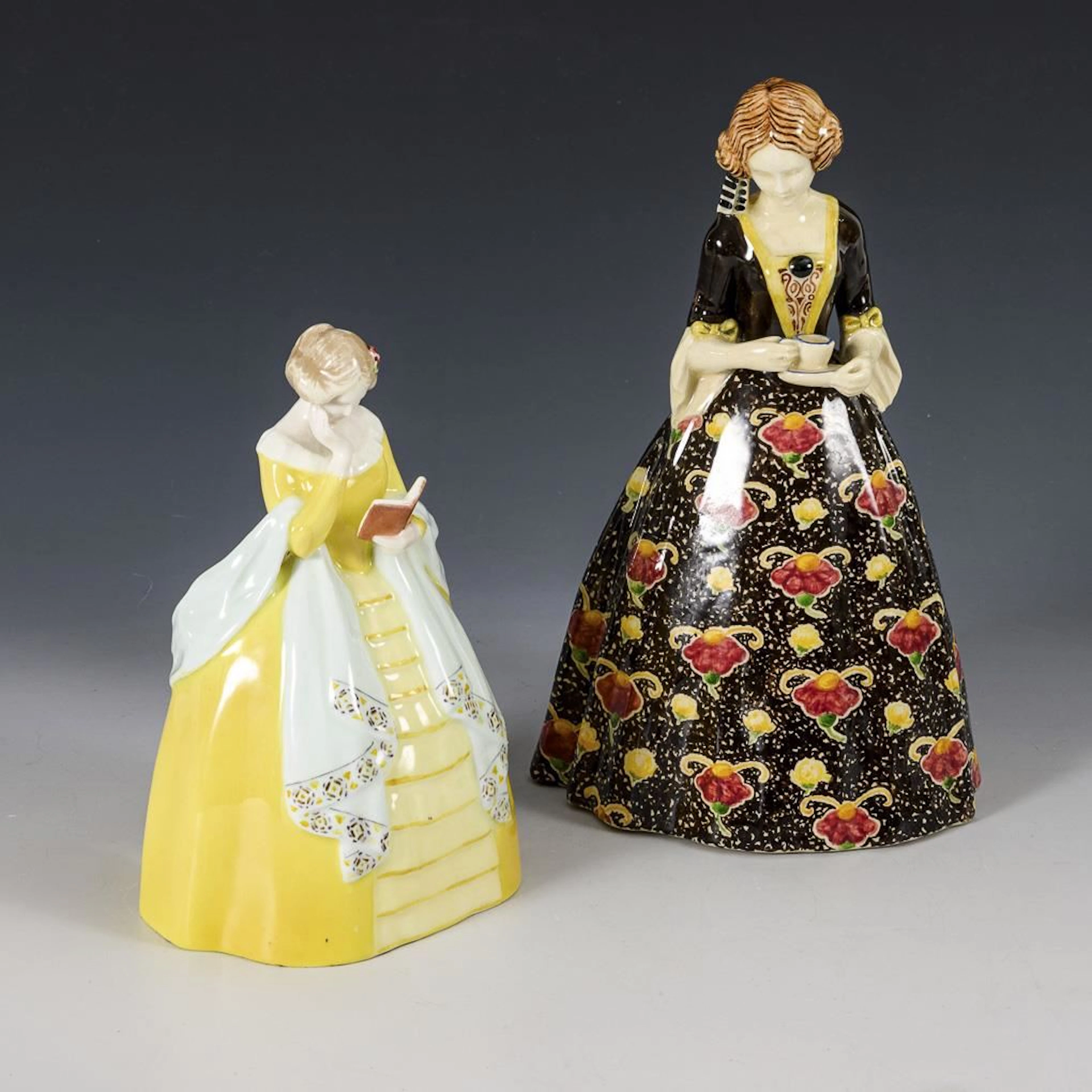 2 Figures: Women in crinoline dresses.