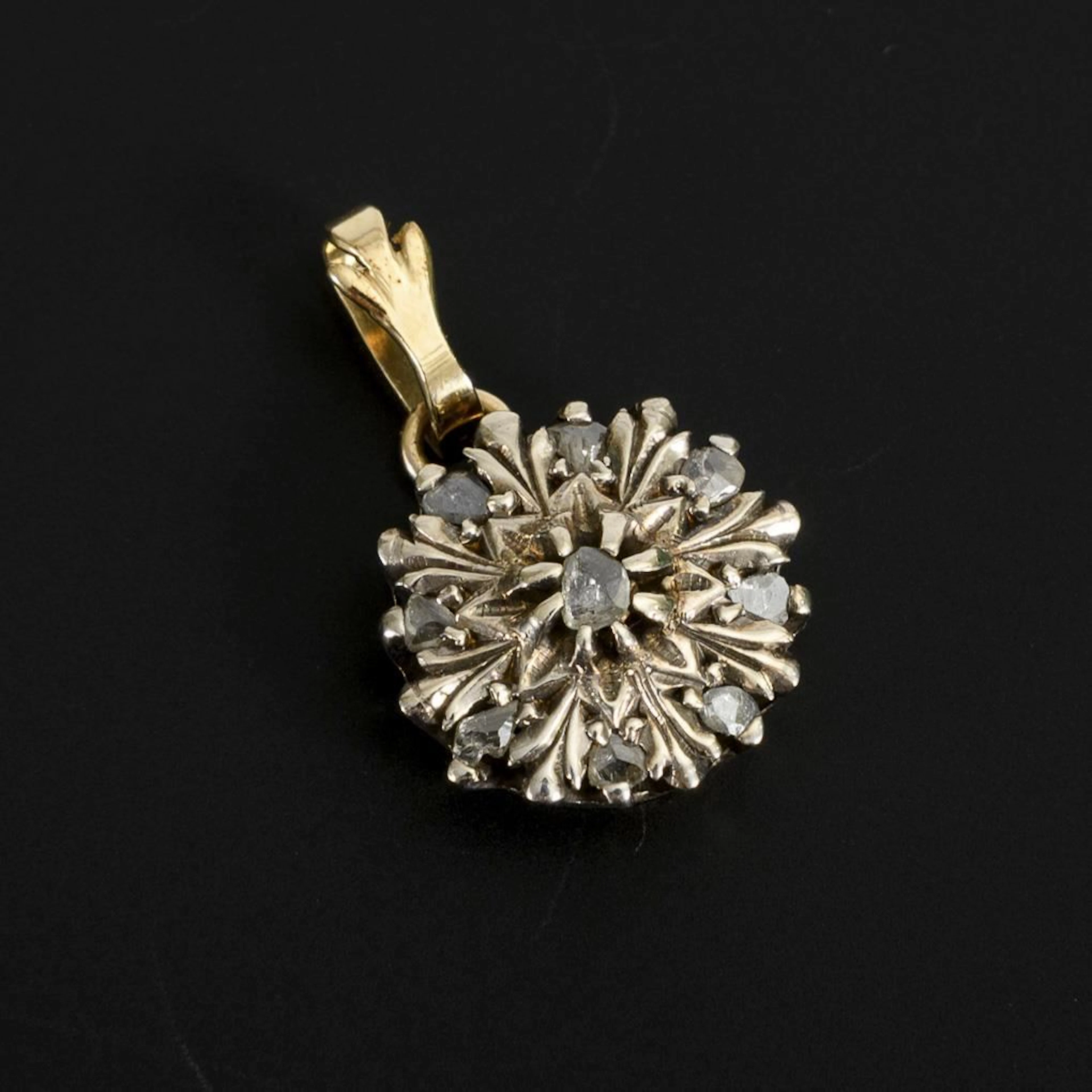 Pendant featuring a historic floral motif.