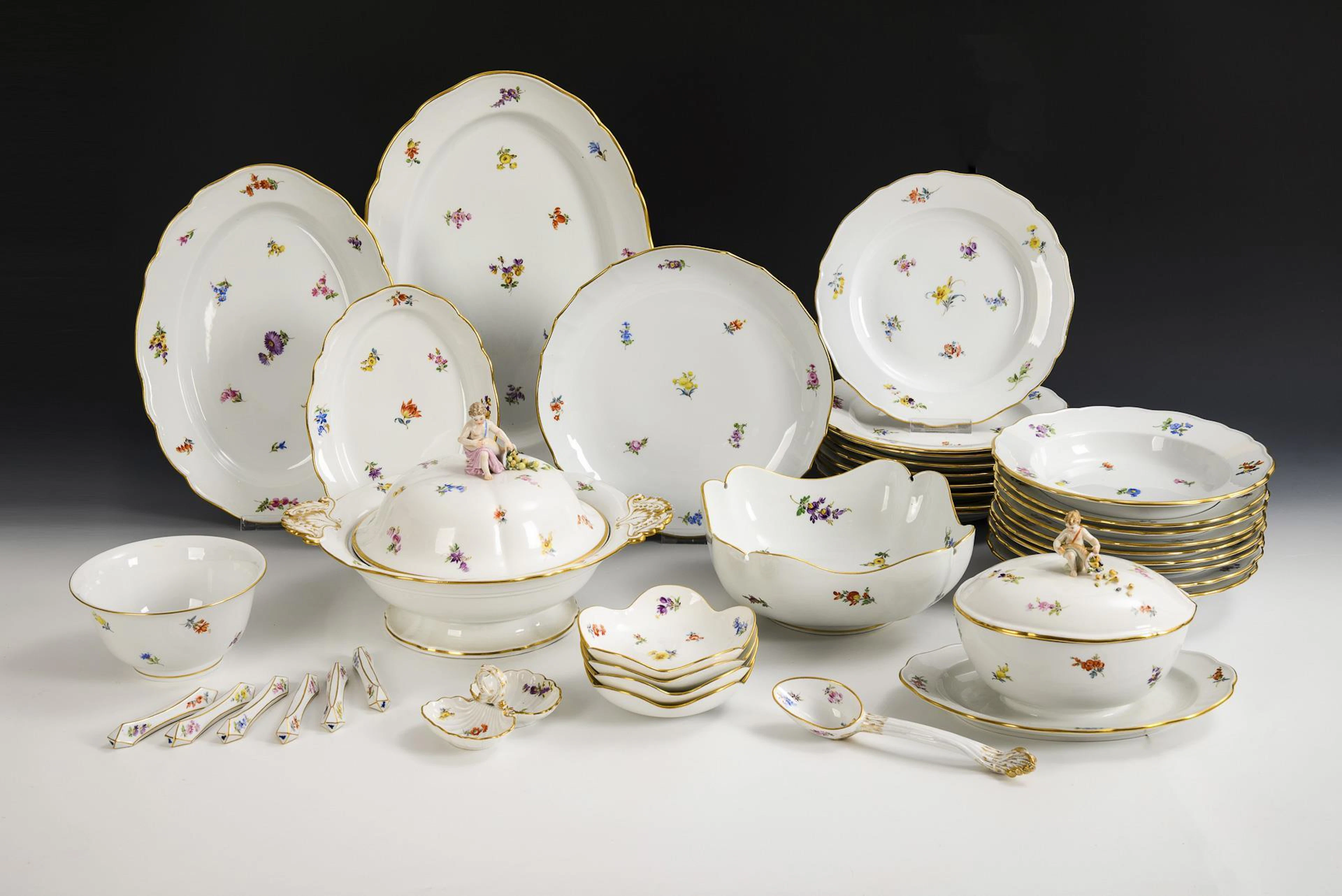 Dinner service with scattered flower painting. Meissen.