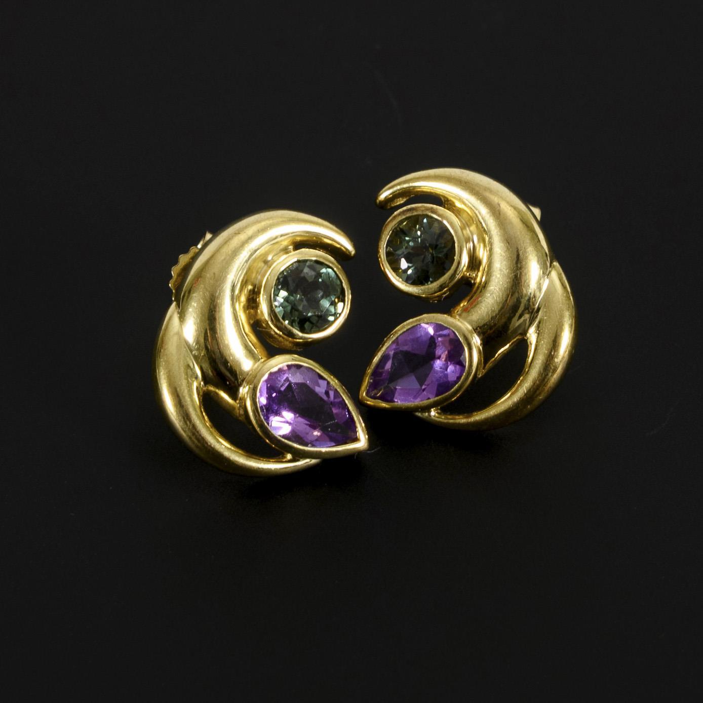 Ear studs with two different colored stones.