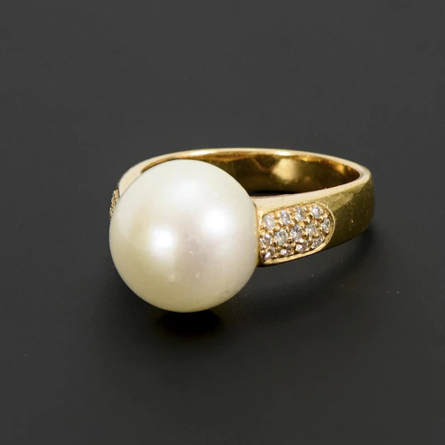Ring with a large freshwater pearl.