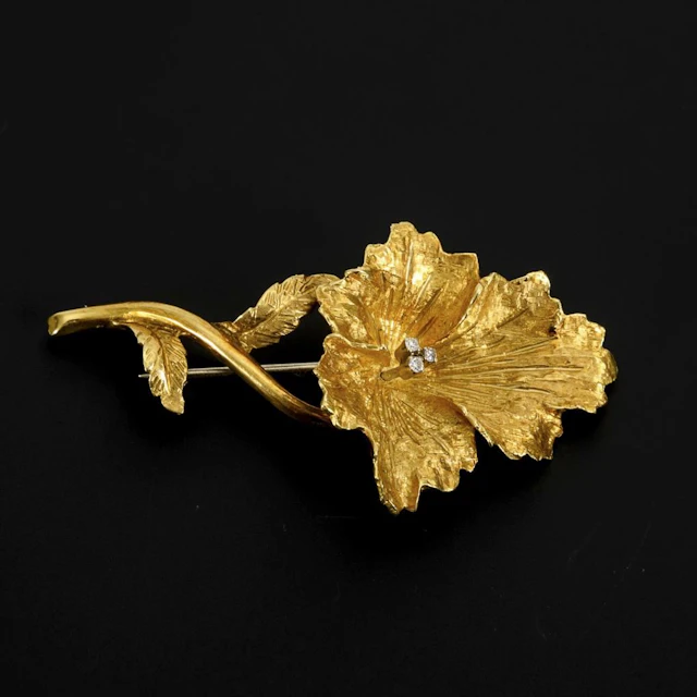 Floral brooch with diamonds.