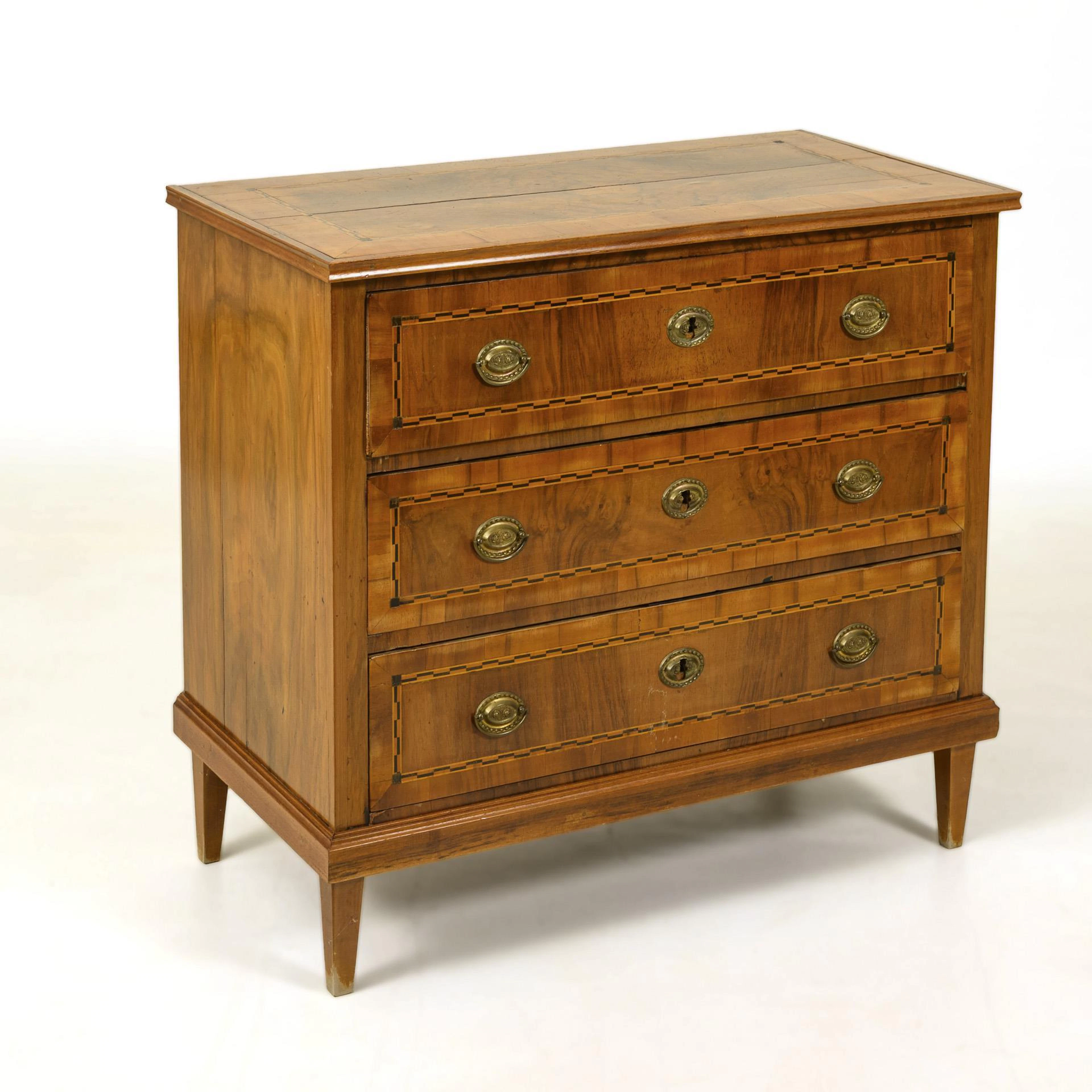 Classical chest of drawers with inlaid bands.