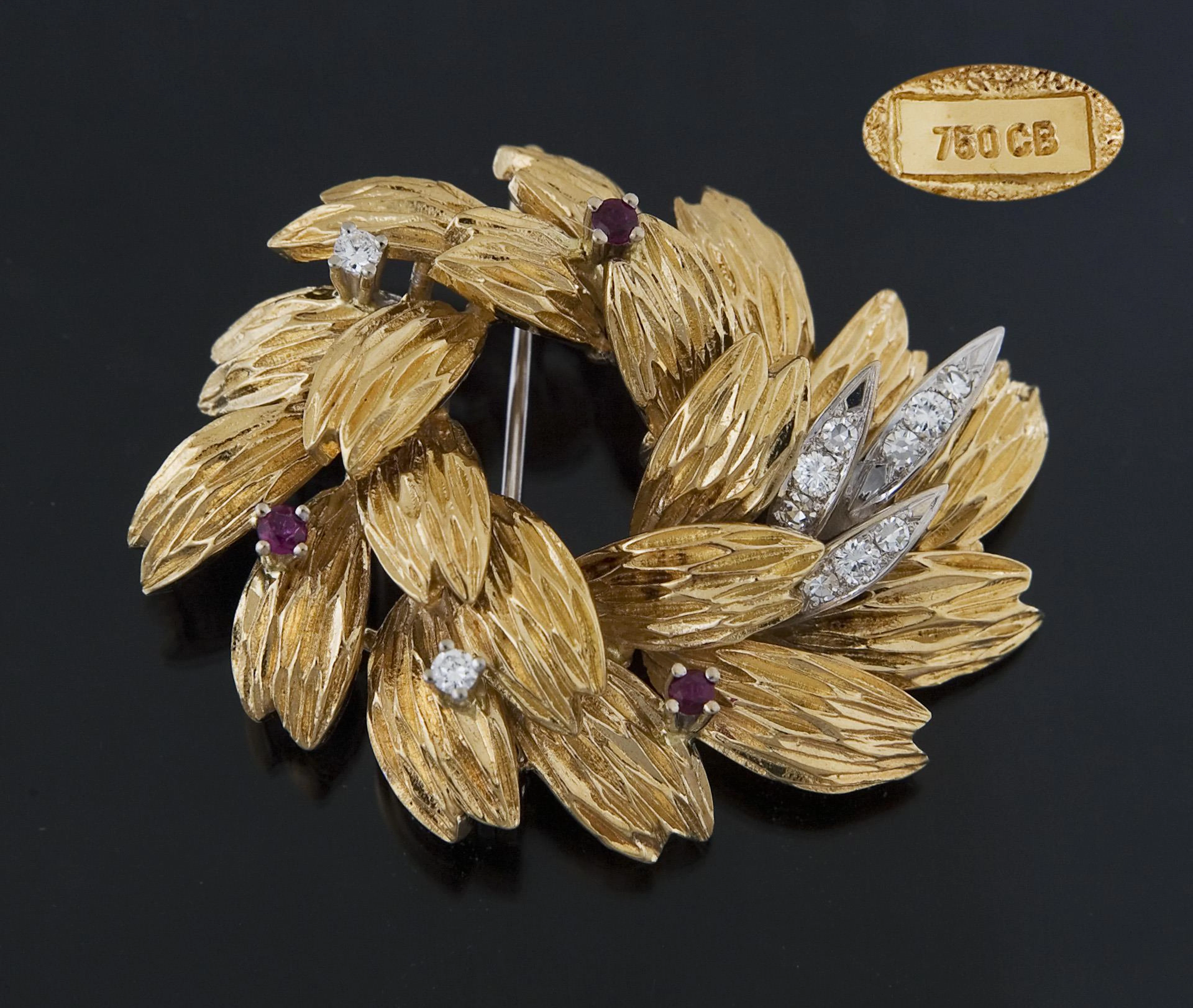 Gold brooch with rubies and diamonds. Carl Bucherer.