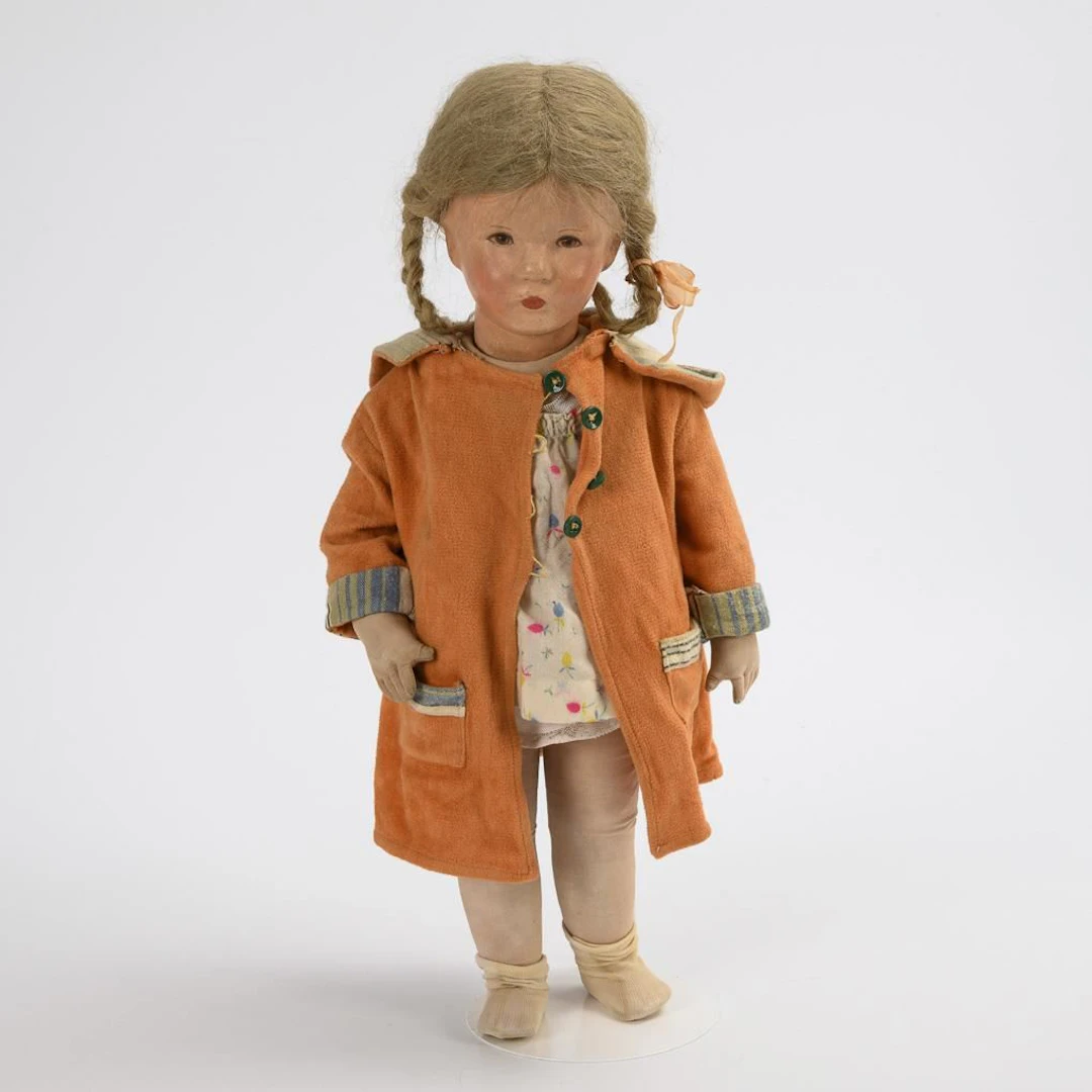 Blonde doll girl in a bathrobe. Käthe Kruse.