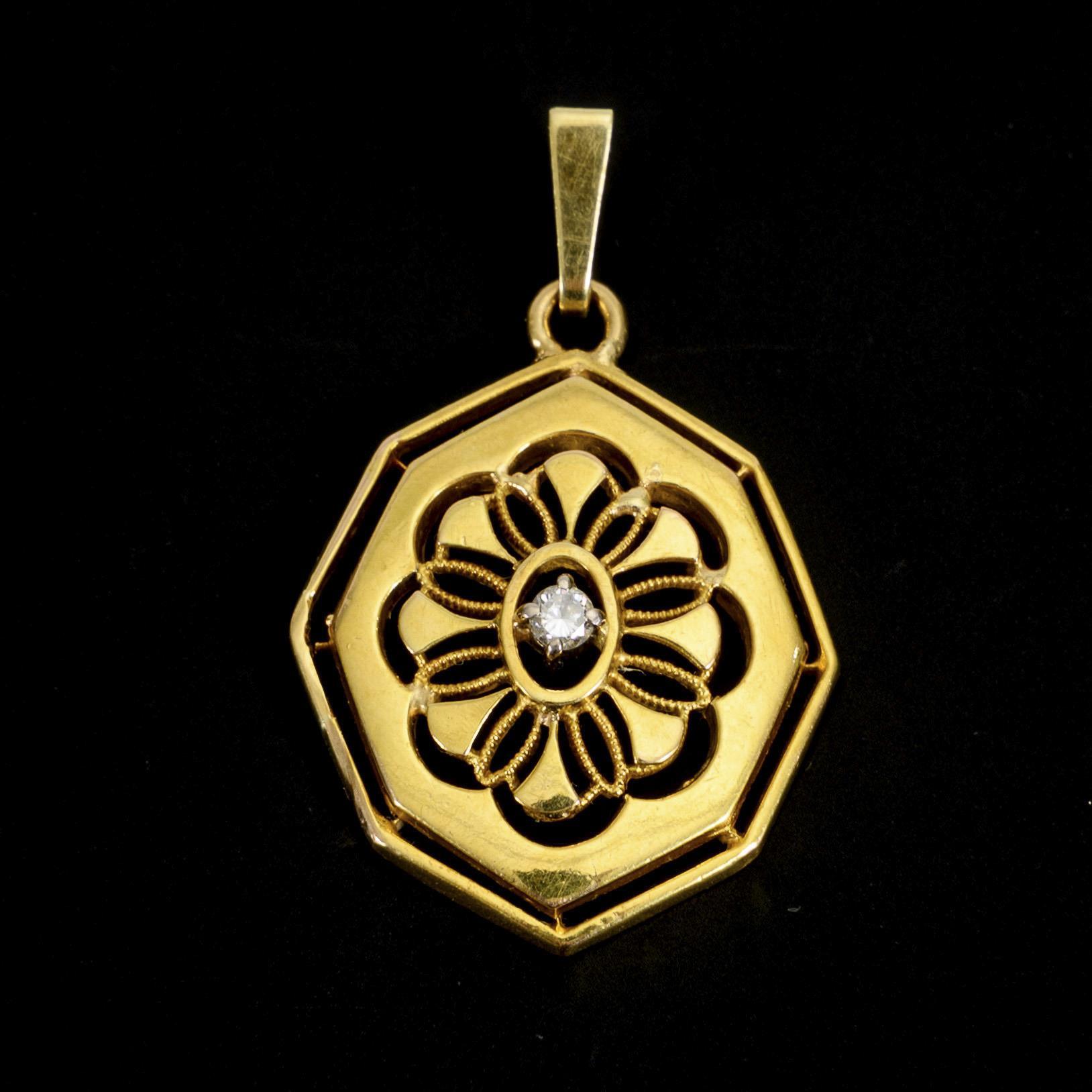 Pendant with flower-shaped opening.