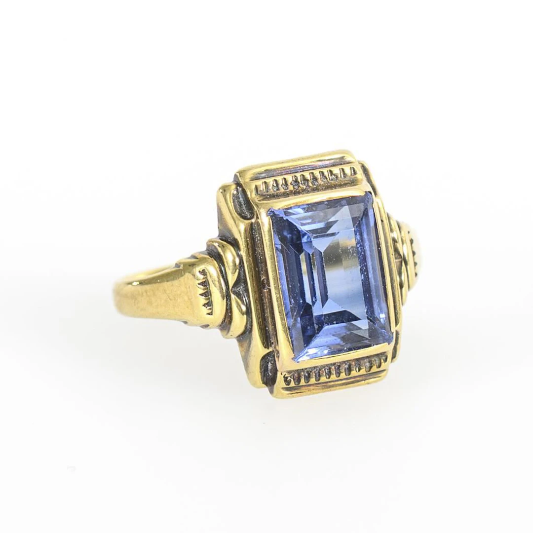 Ring with a blue gemstone or synthetic stone.