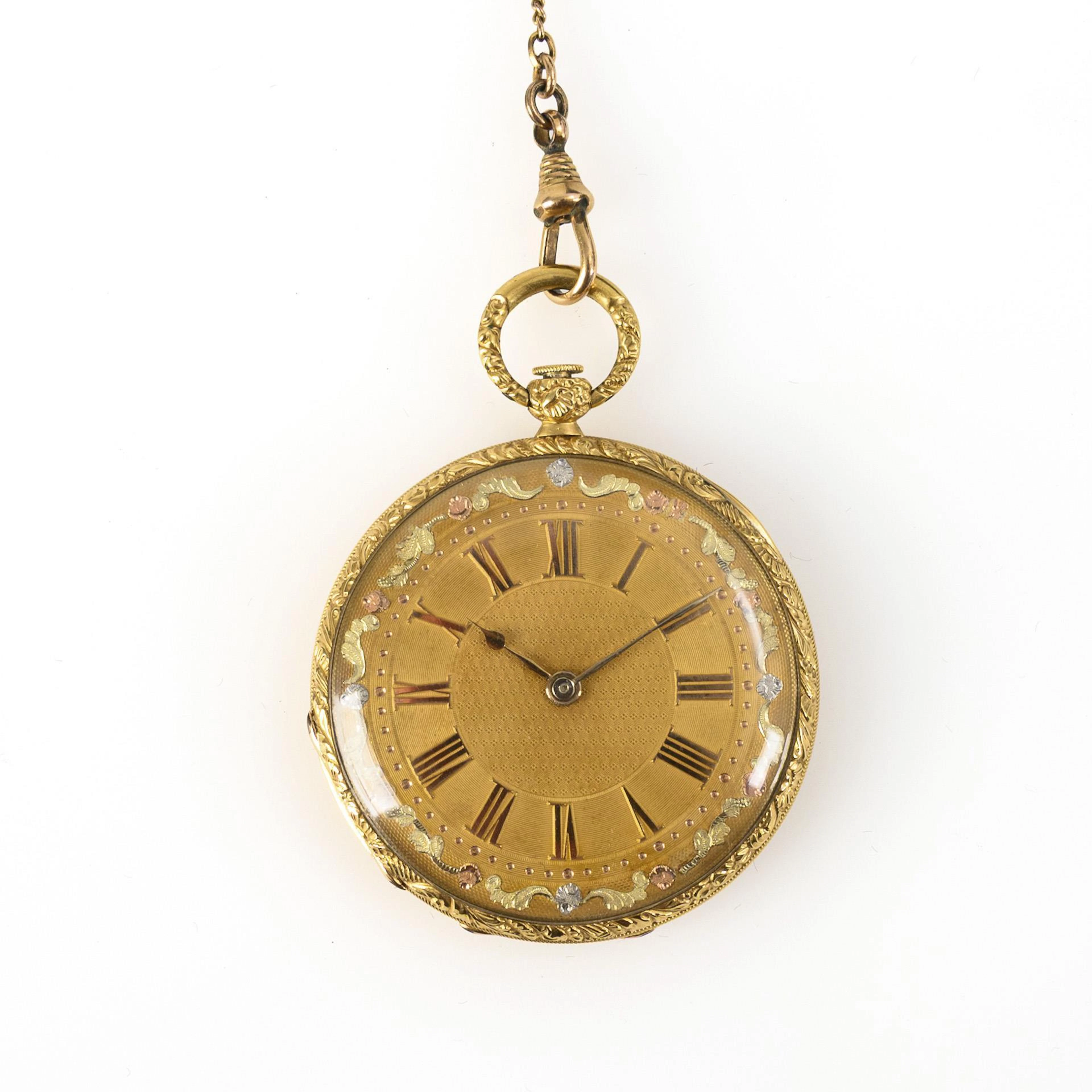 Elegant gold key pocket watch with watch chain.