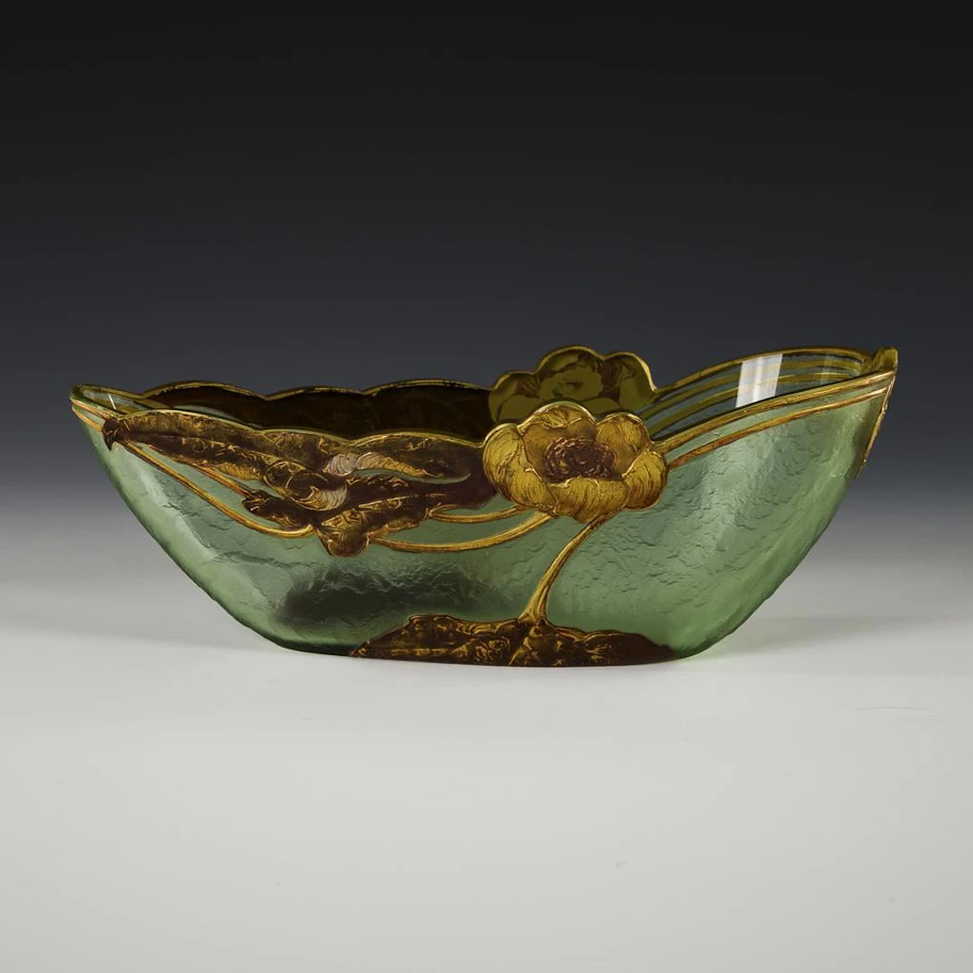 Art Nouveau jardinière with water lily decoration.