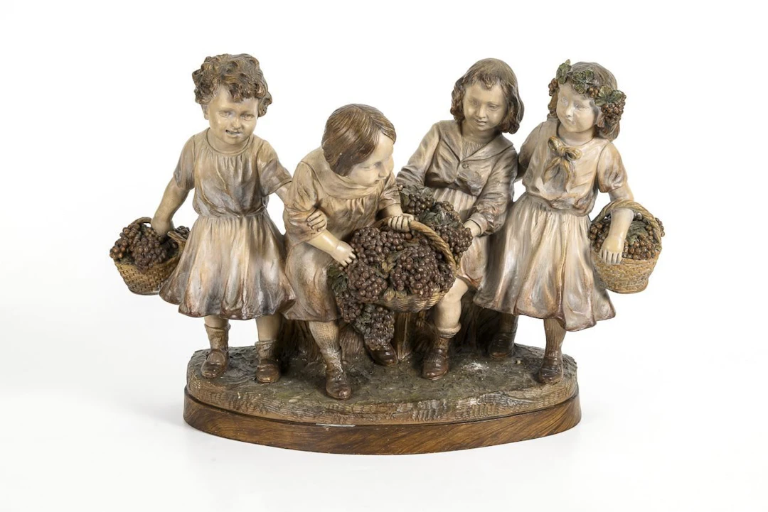 Large Art Nouveau terracotta sculpture group of children titled "Grape Harvest"