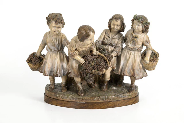 Large Art Nouveau terracotta sculpture group of children titled "Grape Harvest"