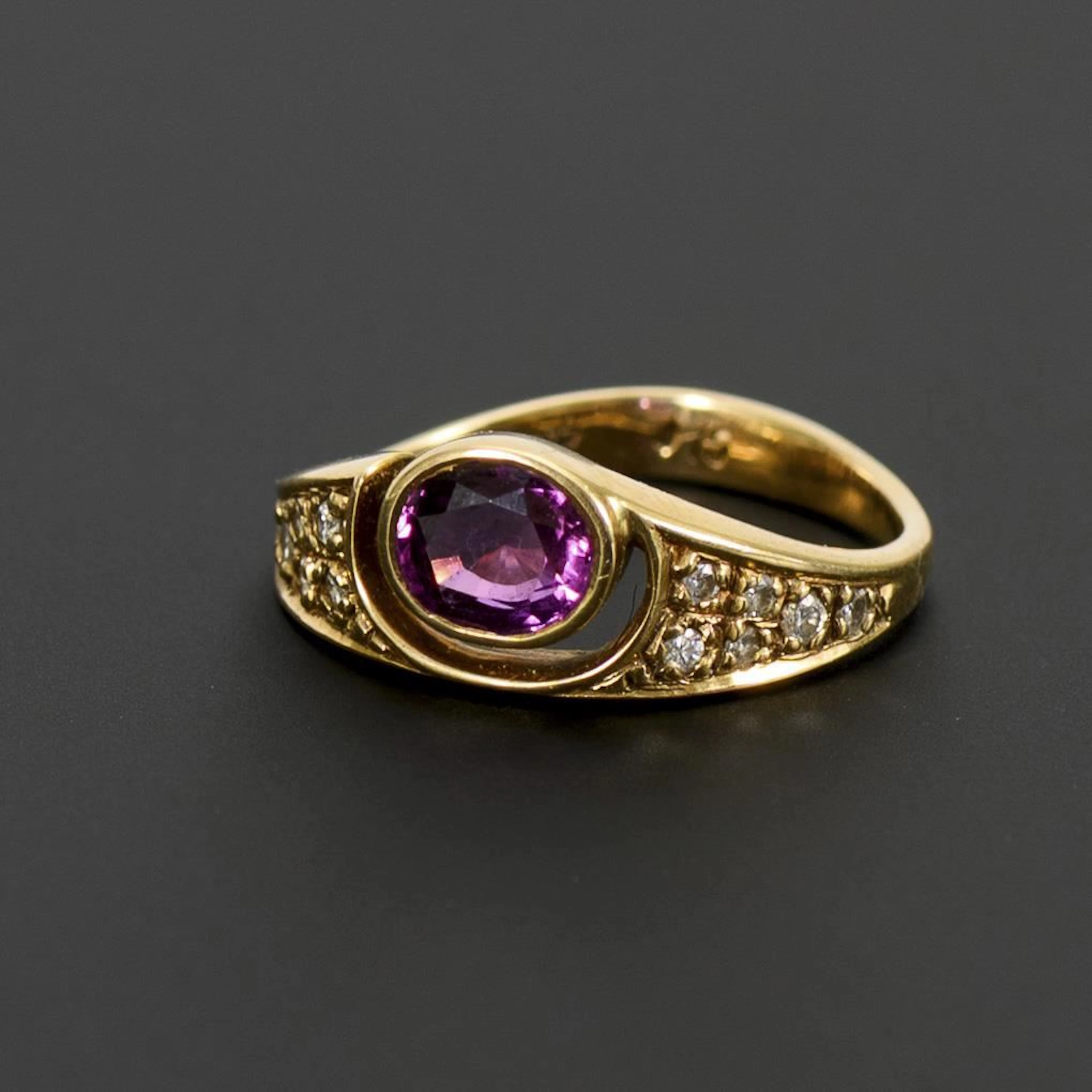Ring with a red gemstone, likely a ruby.