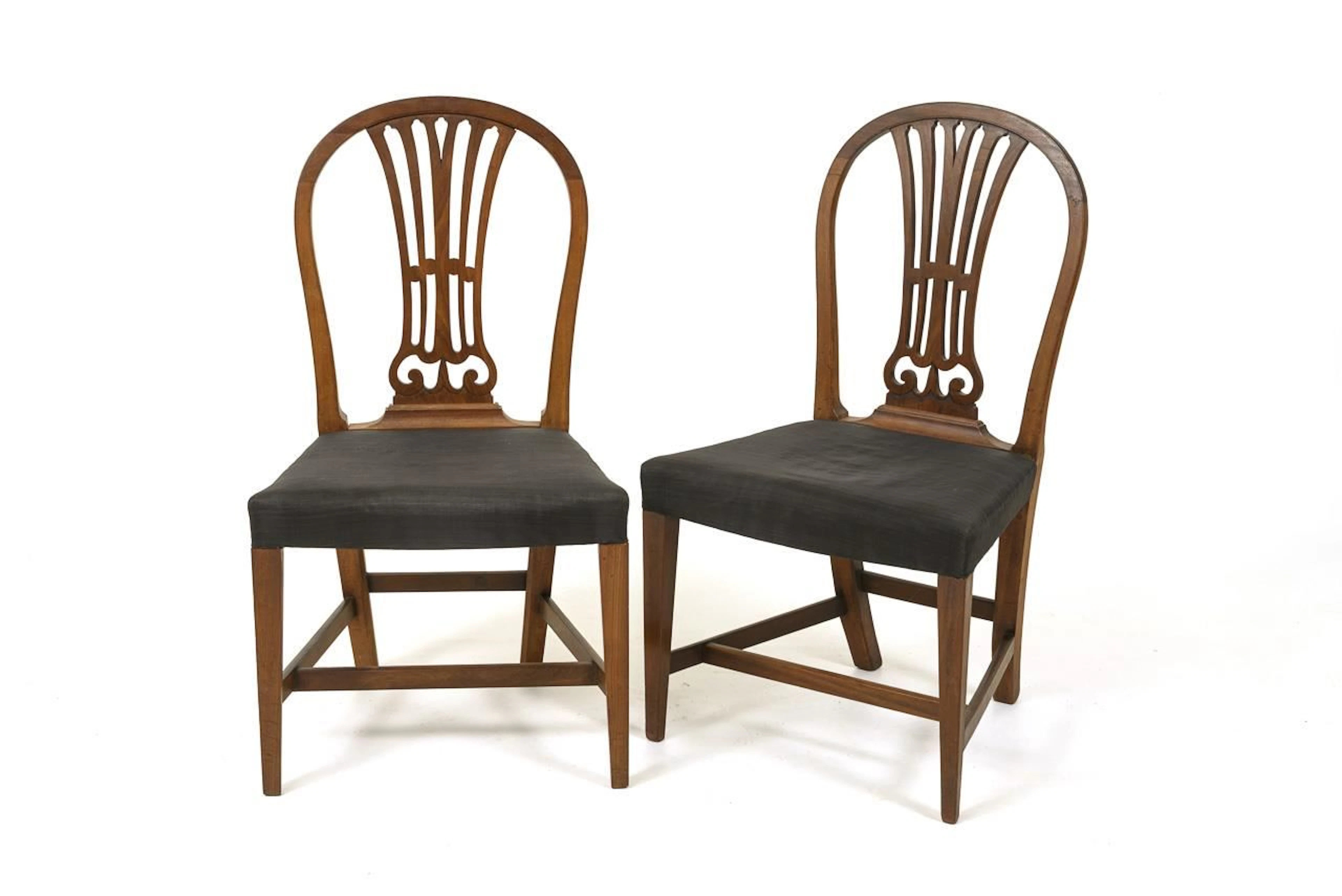 2 English upholstered chairs. In the style of George Hepplewhite.