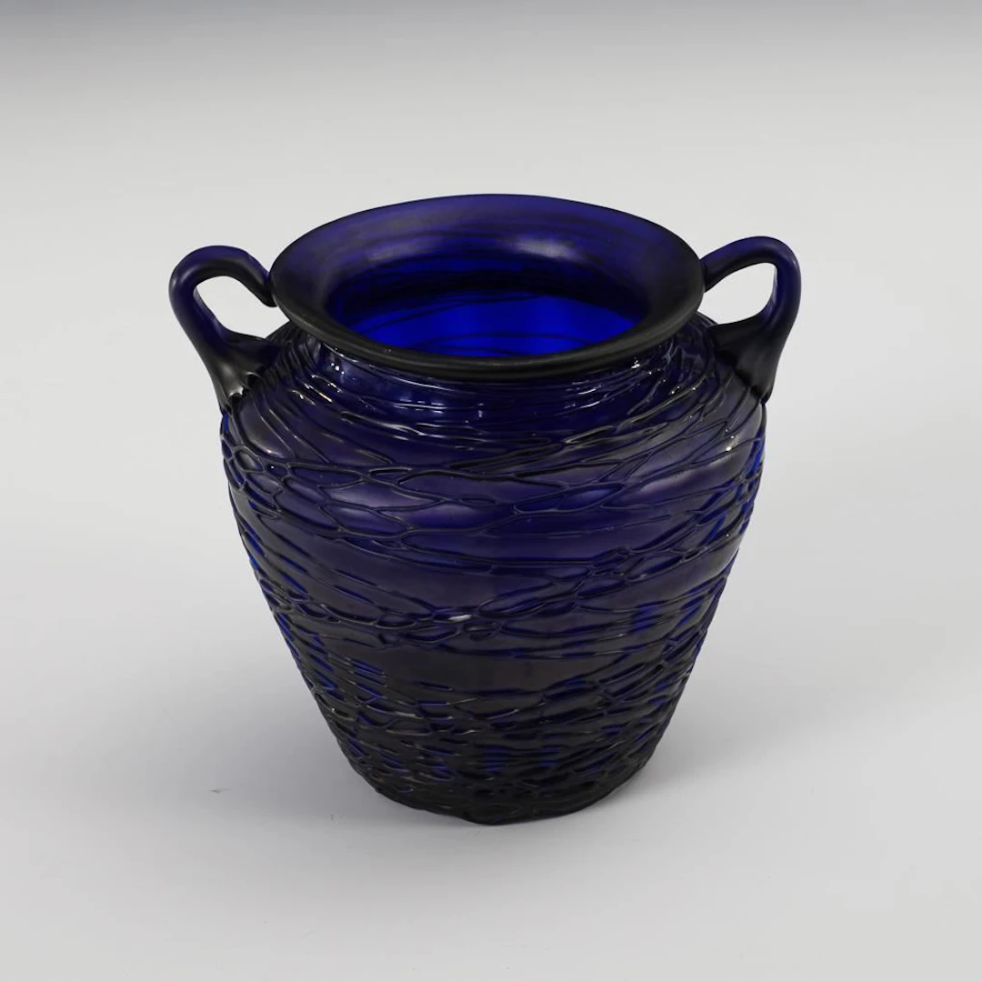 Double-handled vase with a delicate thread-like pattern. Kralik.