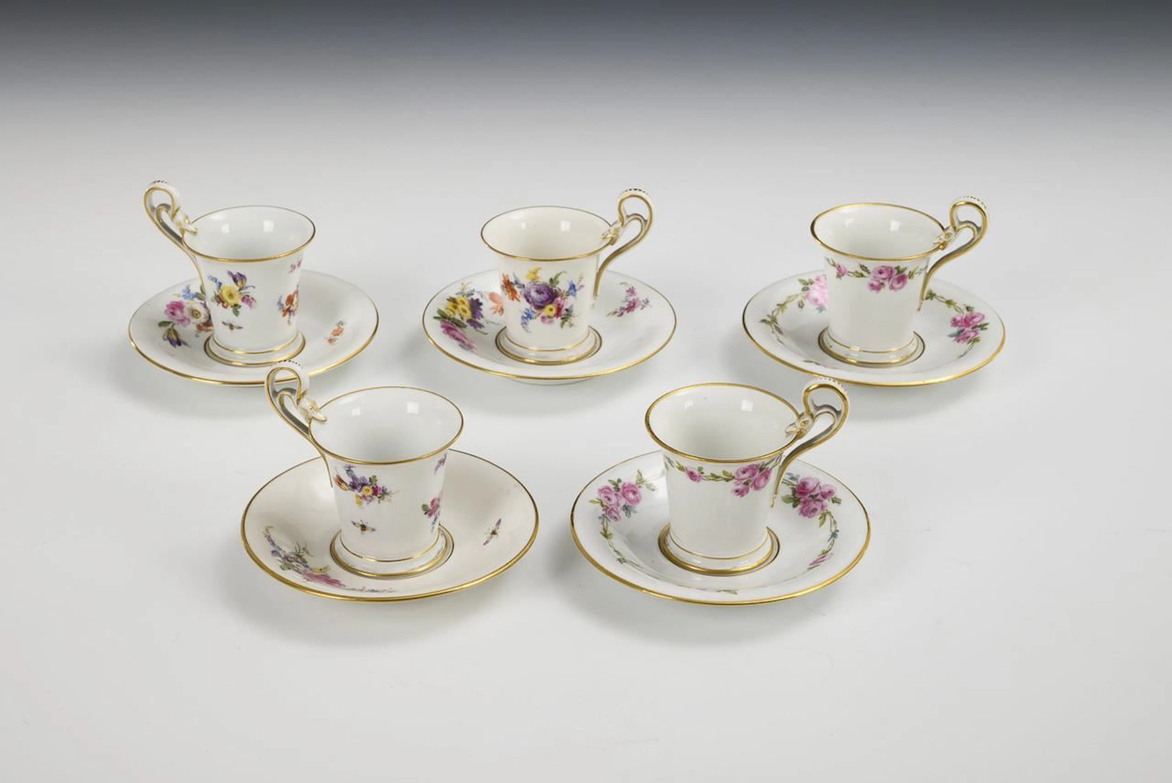 5 mocha cups with floral designs. Meissen.