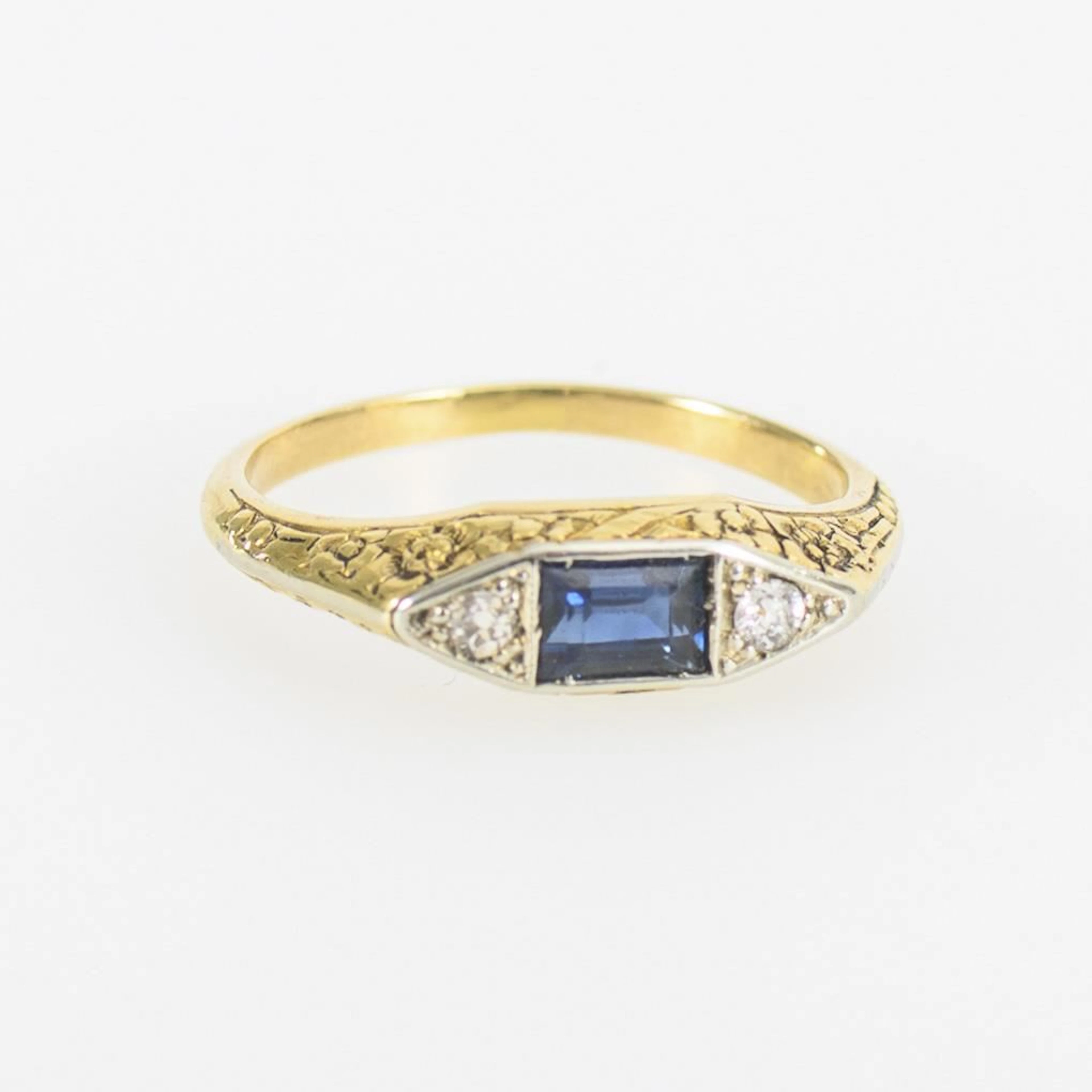 Antique ring with a blue gemstone, likely a sapphire, and 2 diamonds.