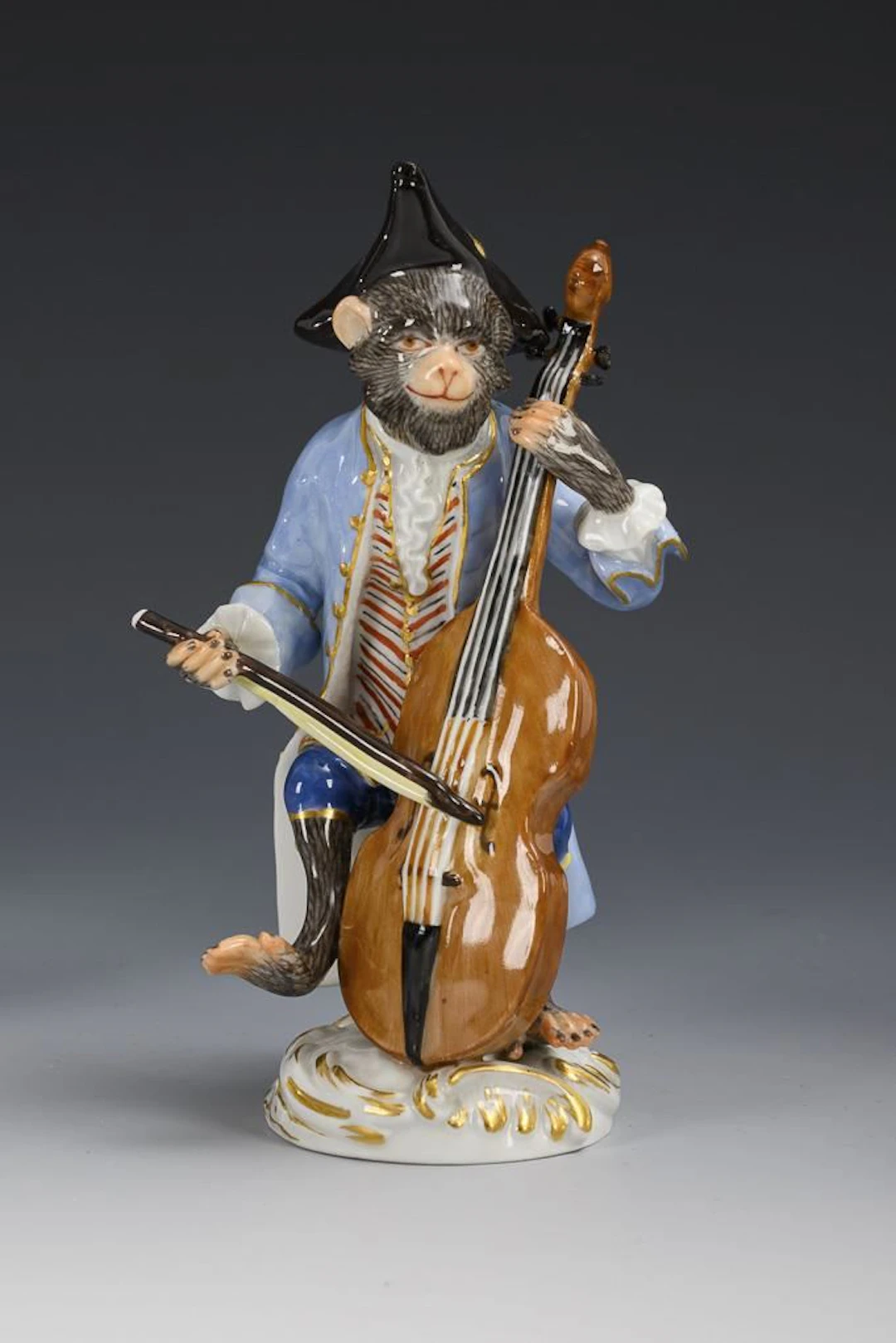 Monkey as a double bass player. Meissen.