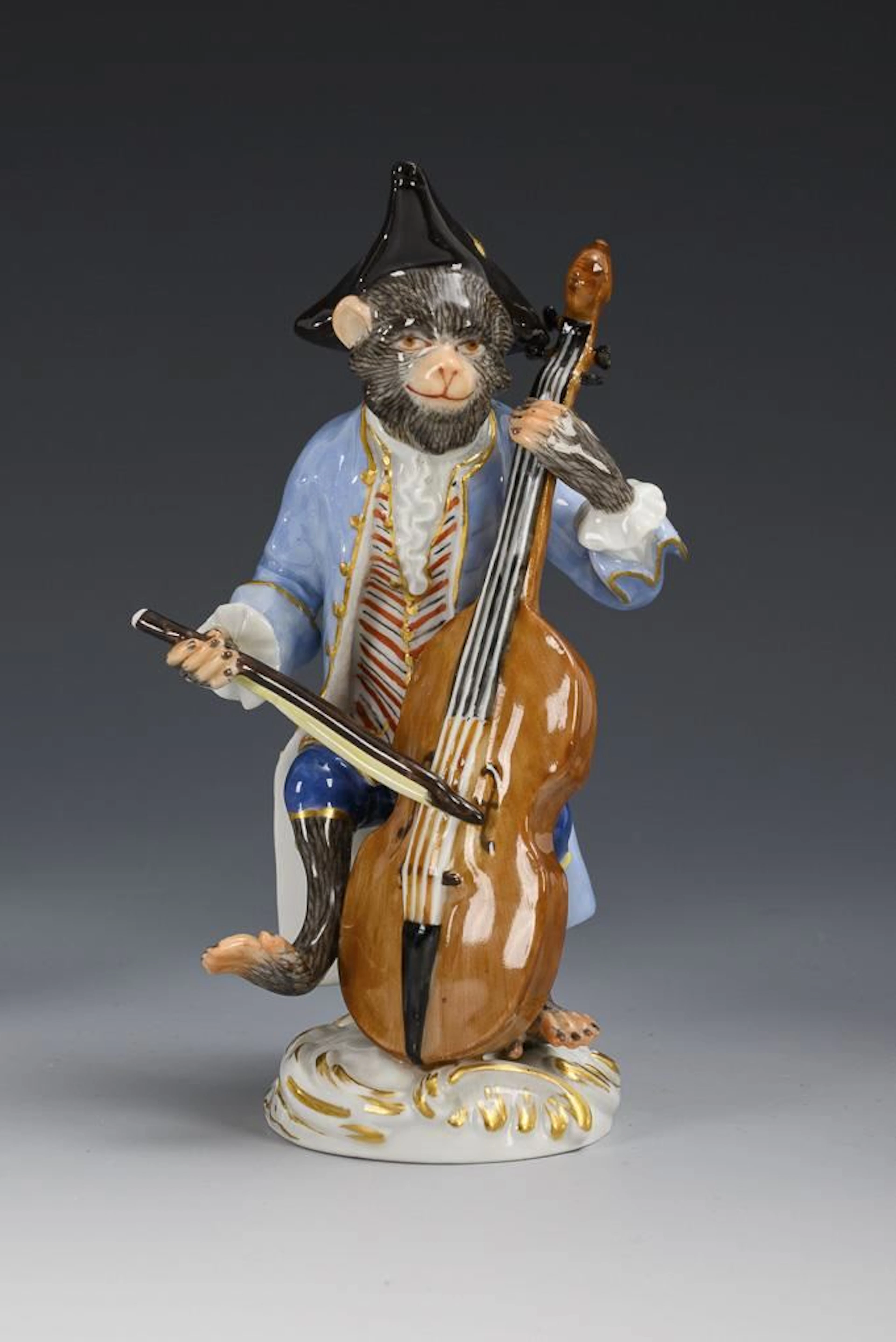 Monkey as a double bass player. Meissen.