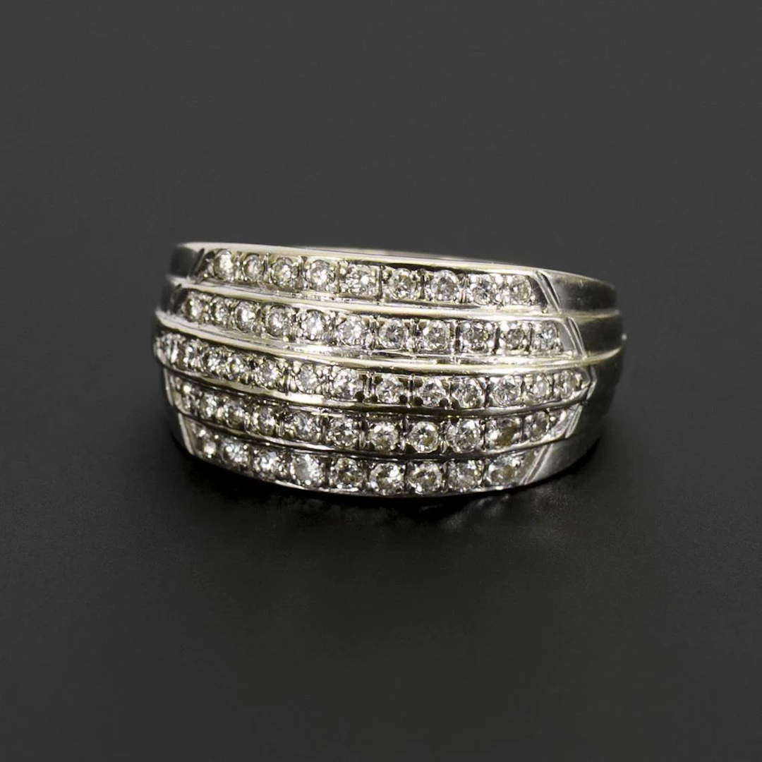 Wide, banded ring with brilliant-cut diamonds.