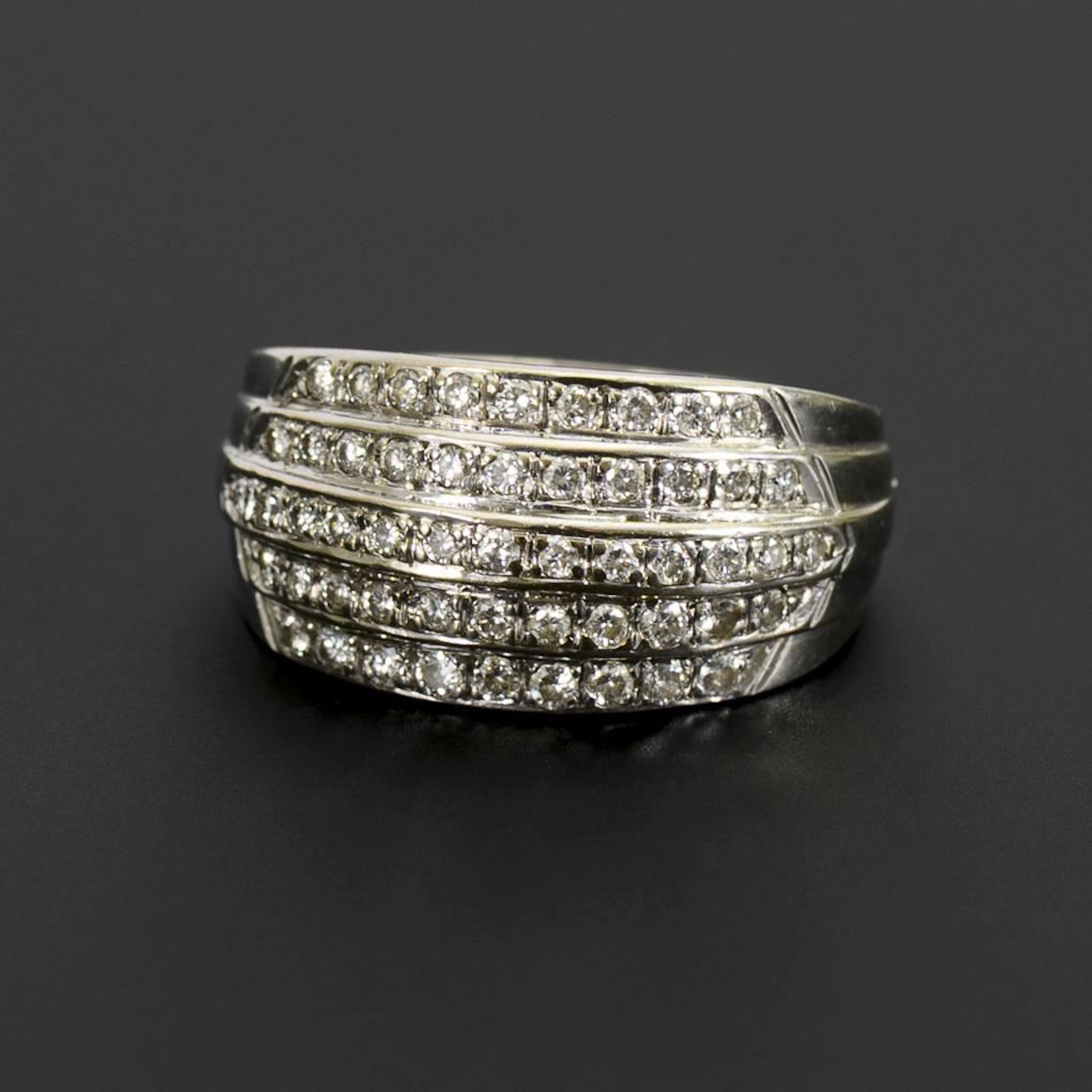 Wide, banded ring with brilliant-cut diamonds.