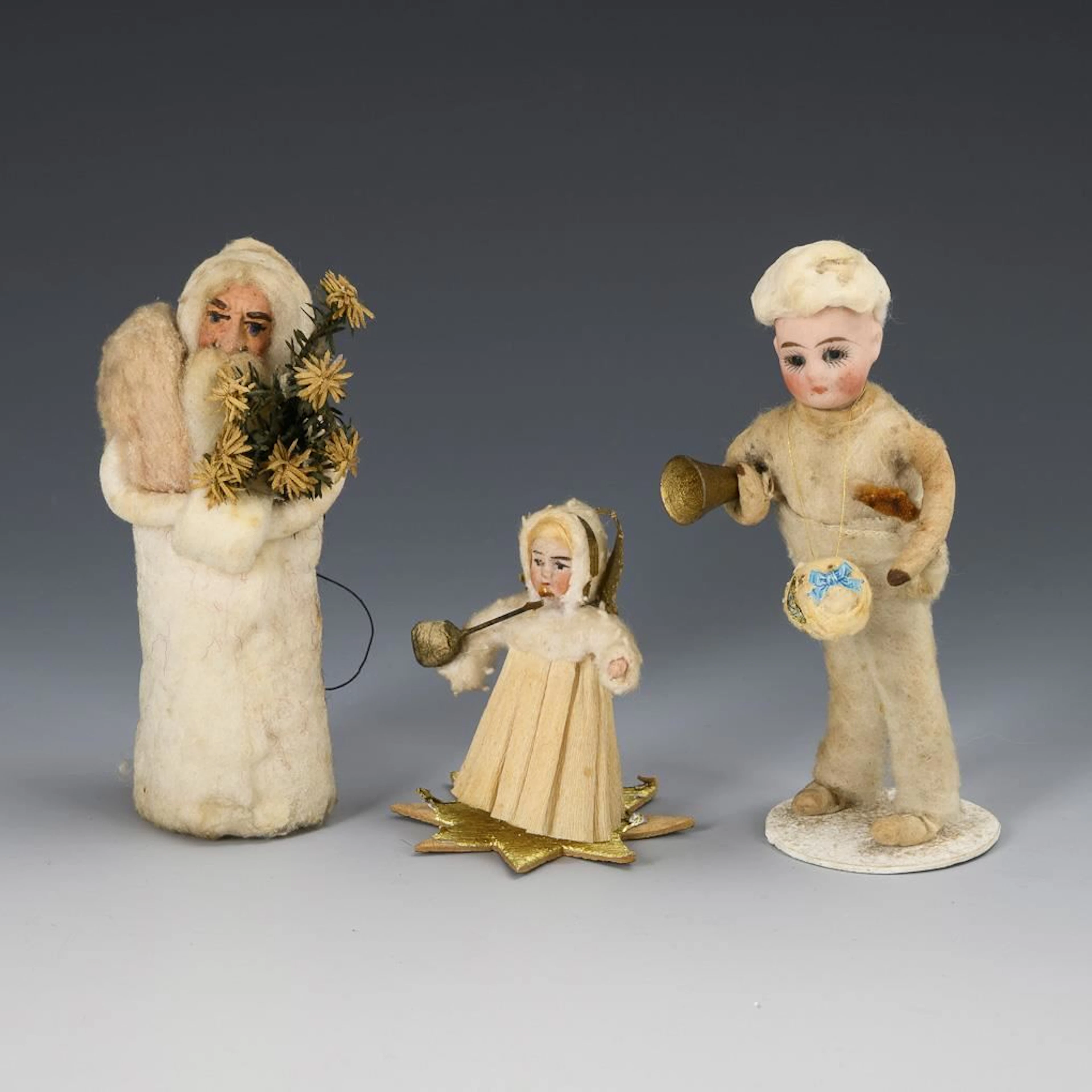 3 pieces of Christmas decorations made from cotton wool.