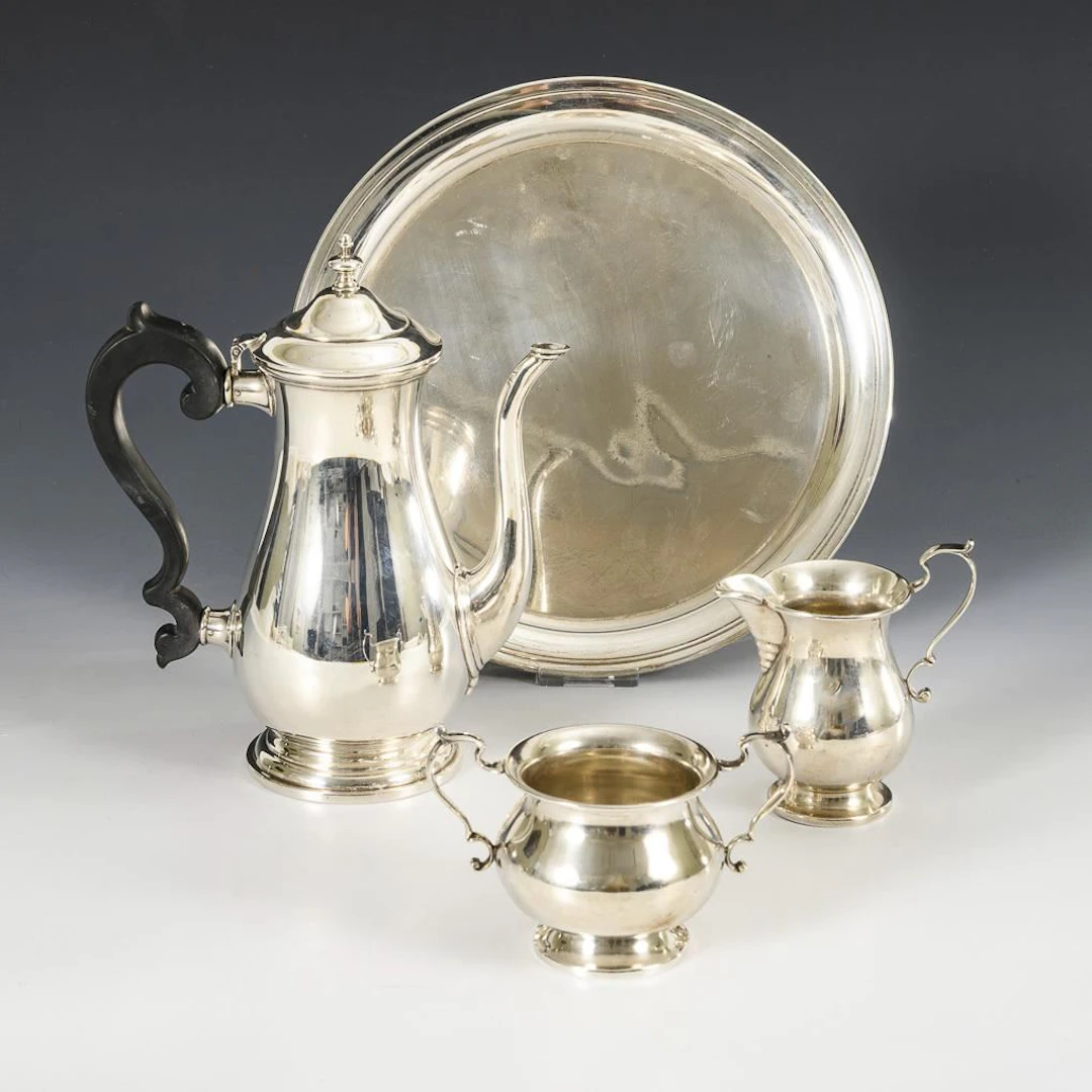 Coffee pot, milk jug, sugar bowl, and round tray.