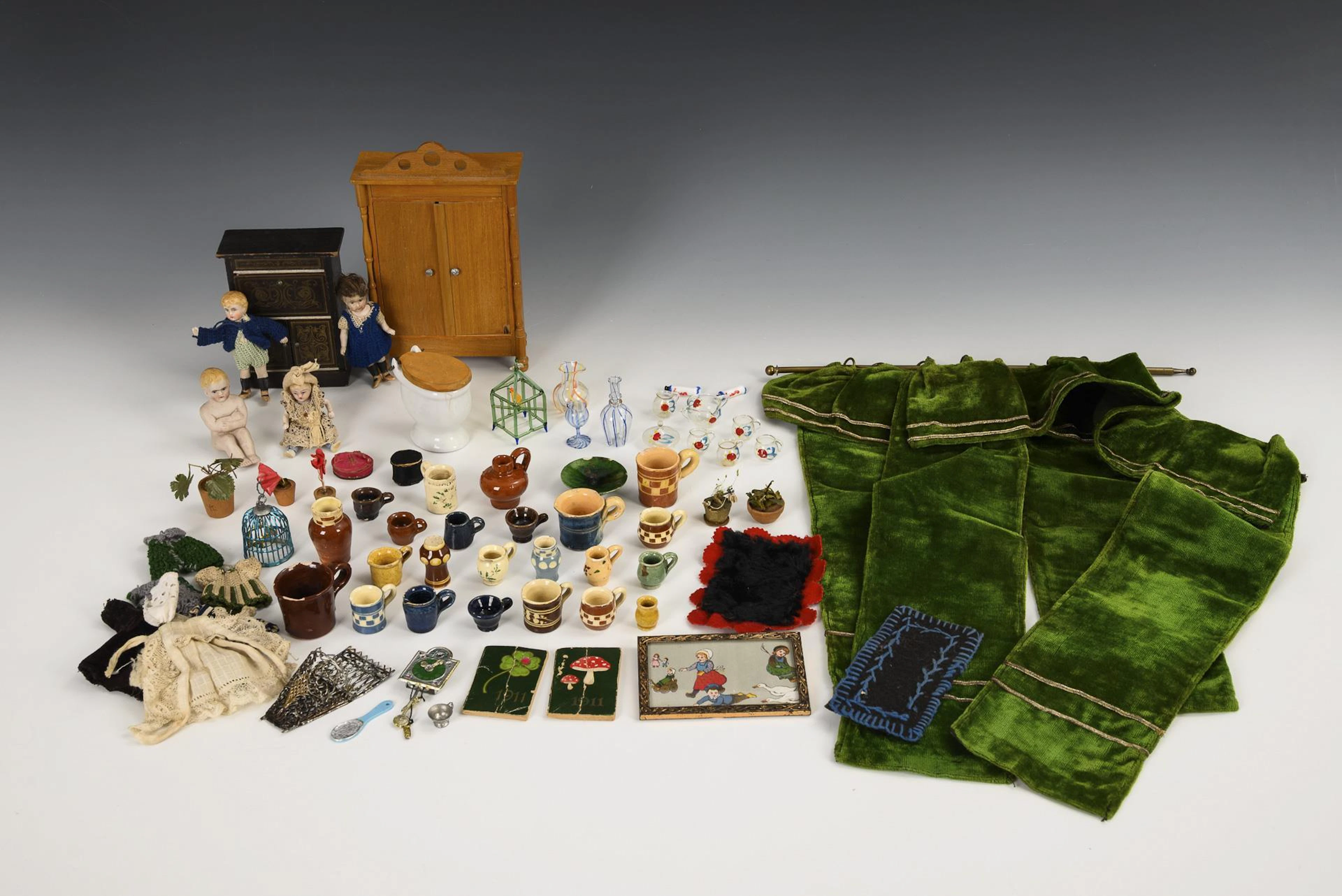 A collection of accessories for old doll's houses.