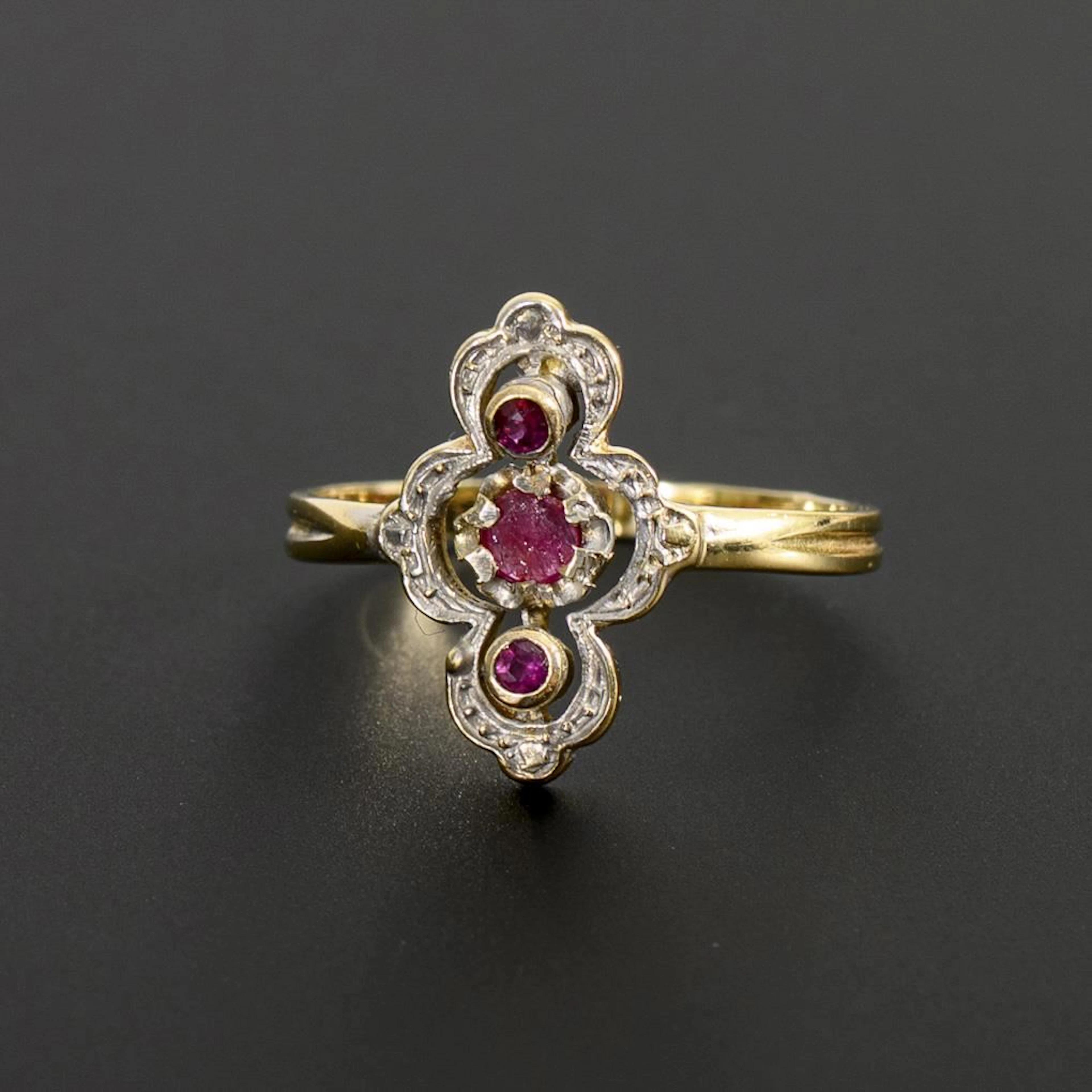 Art Nouveau ring with red gemstones.