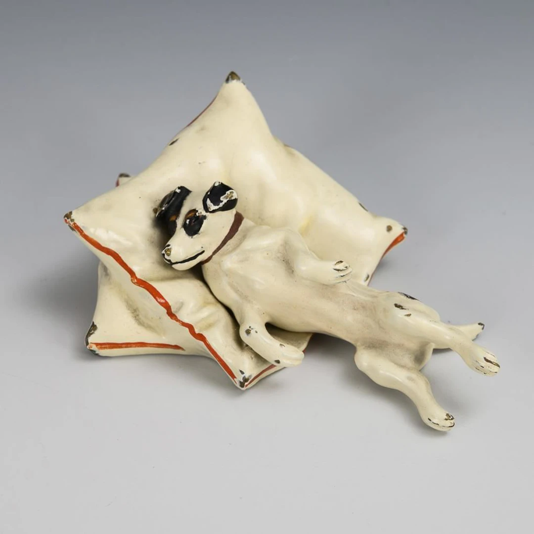 Viennese bronze (?): Reclining Terrier on Pillows