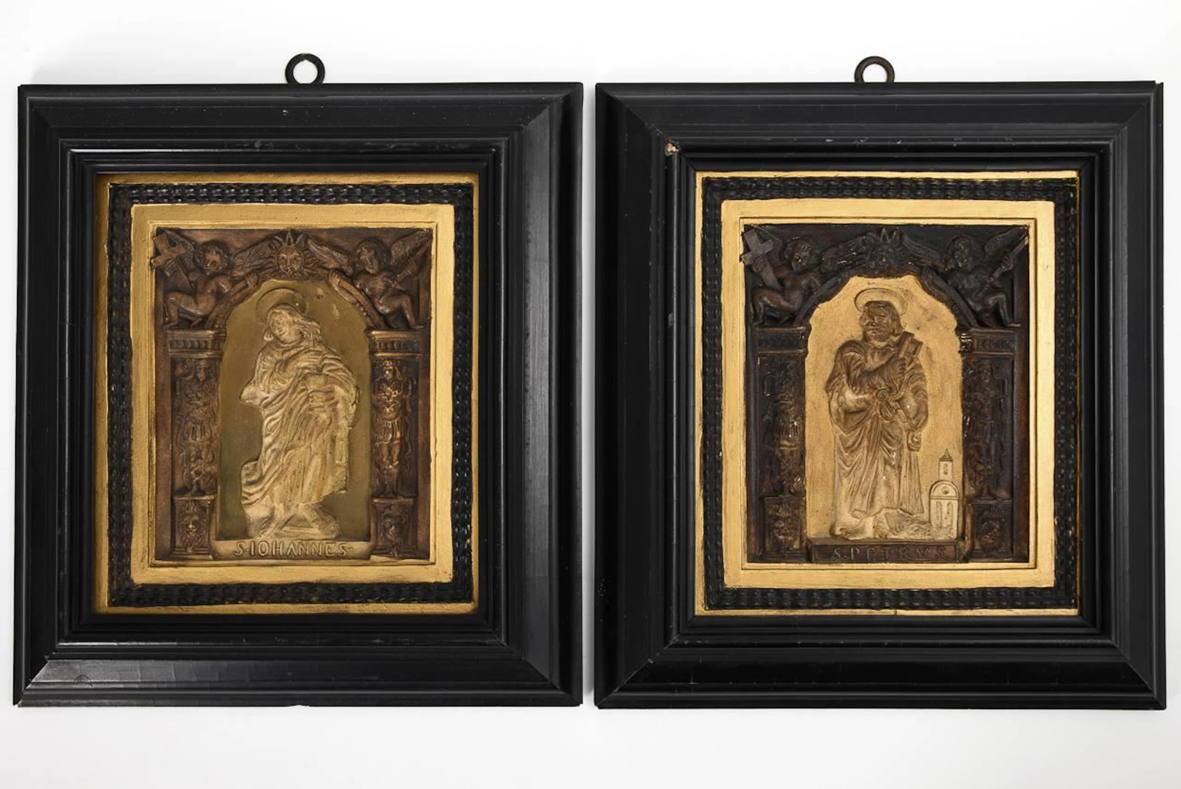 Pair of Renaissance-style relief tiles.