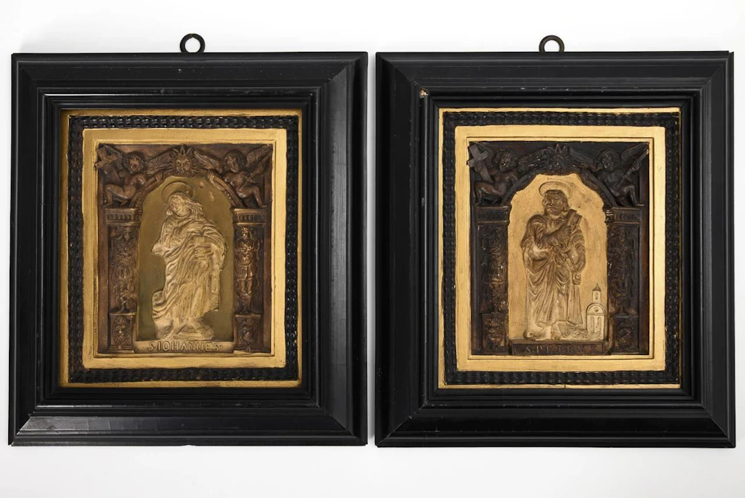 Pair of Renaissance-style relief tiles.