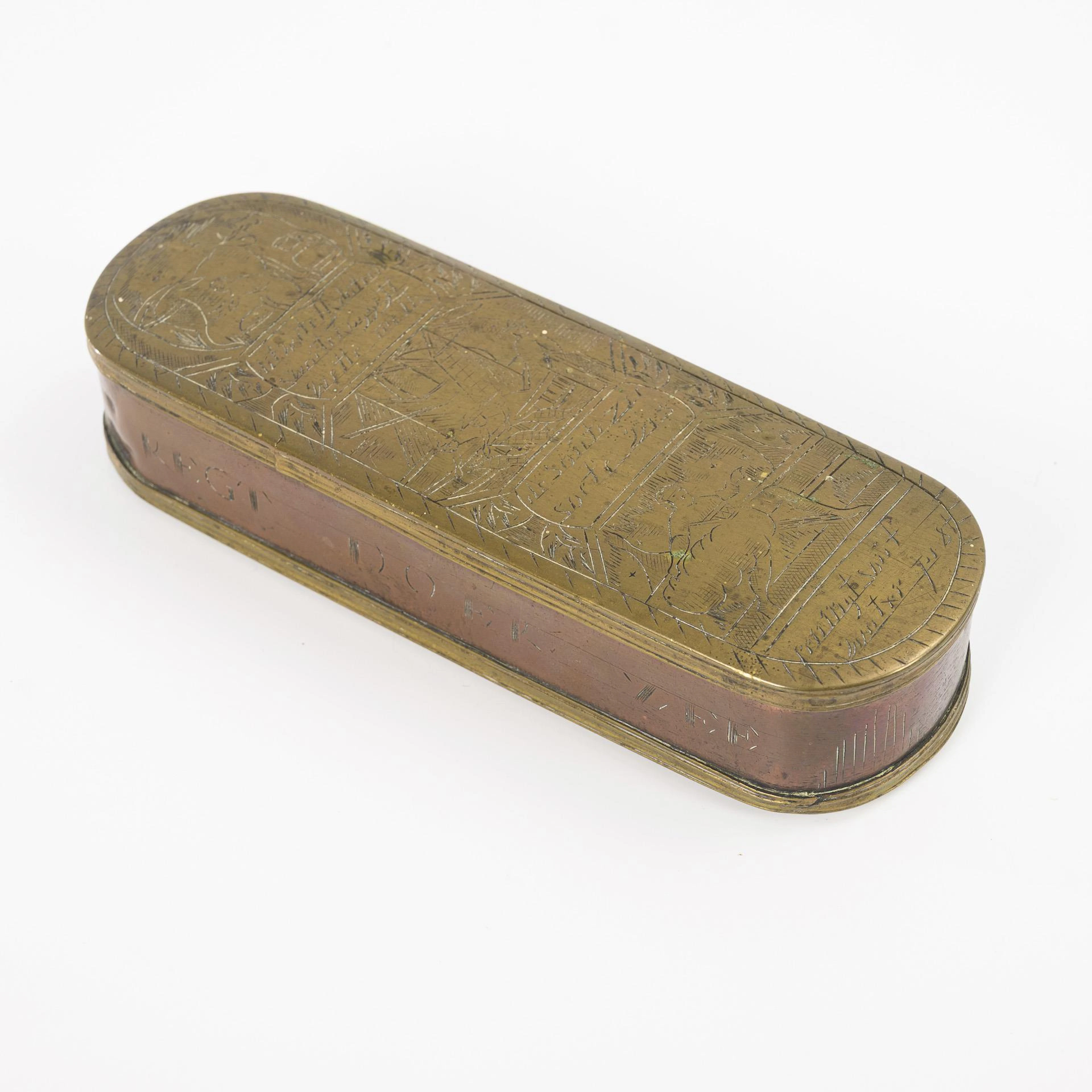 Engraved tobacco tin.