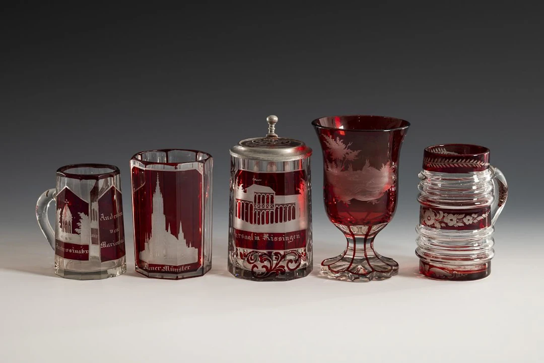 5 glasses with red stain.