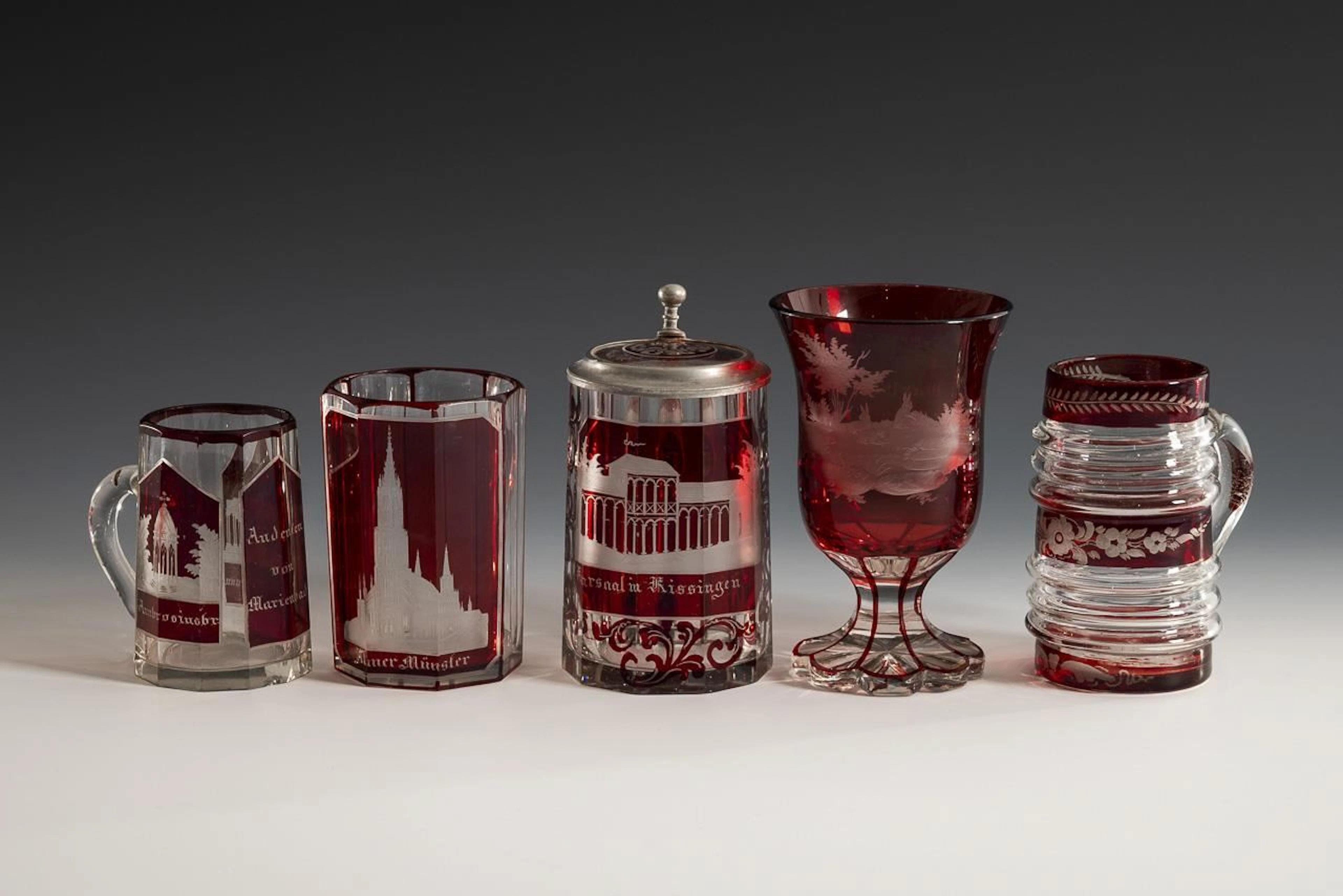 5 glasses with red stain.