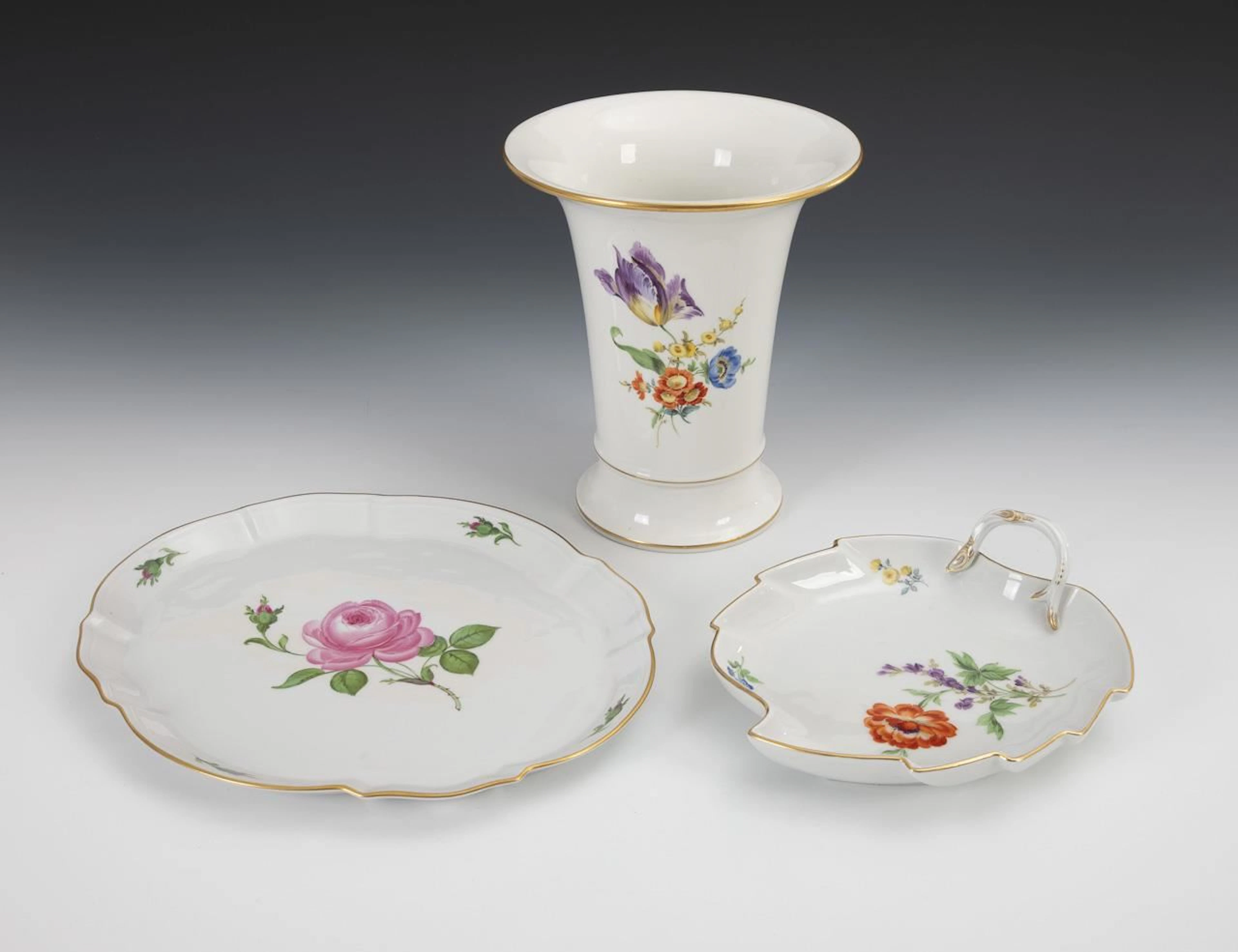 Vase, leaf-shaped bowl, and tray with floral designs. Meissen.