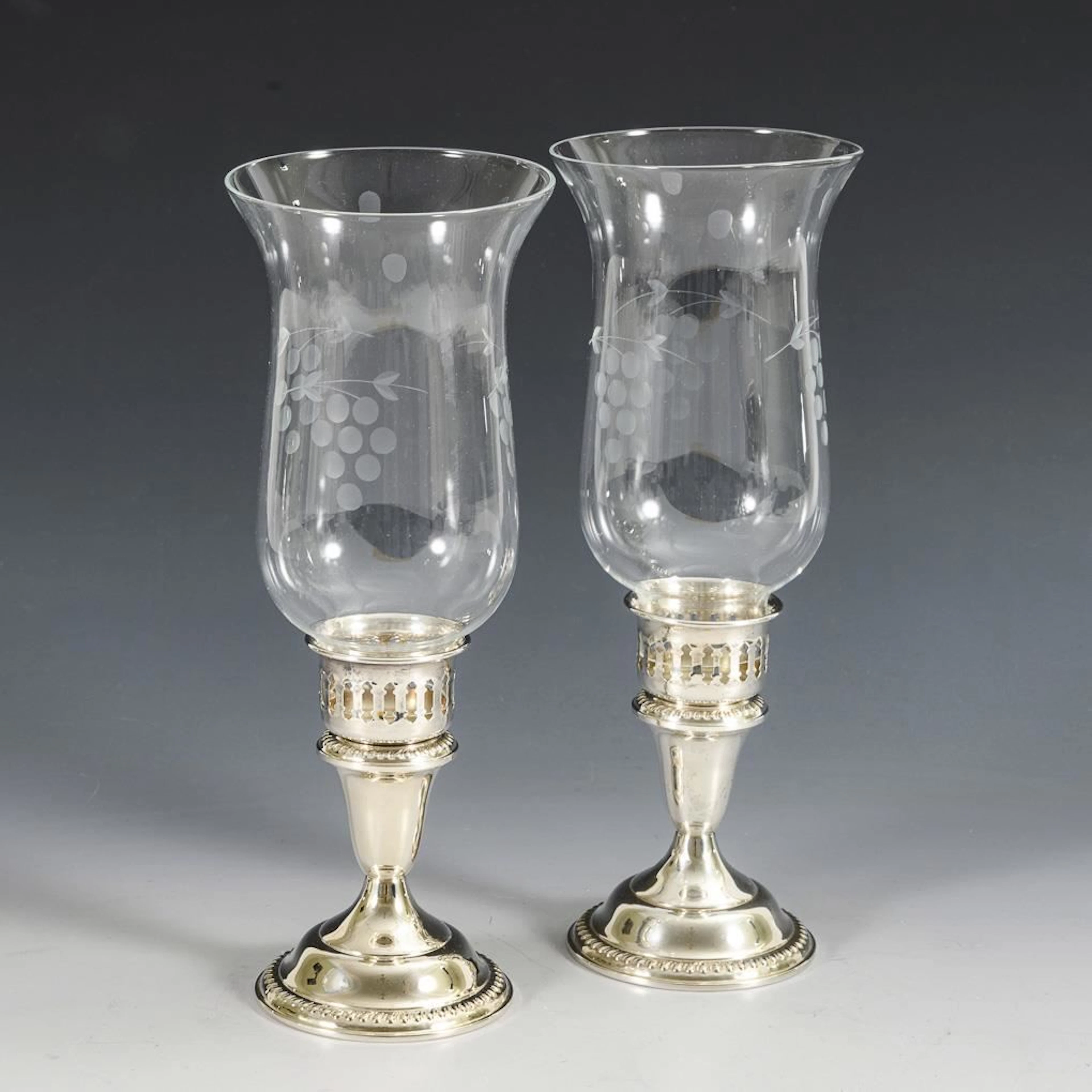 Pair of lanterns with silver bases.