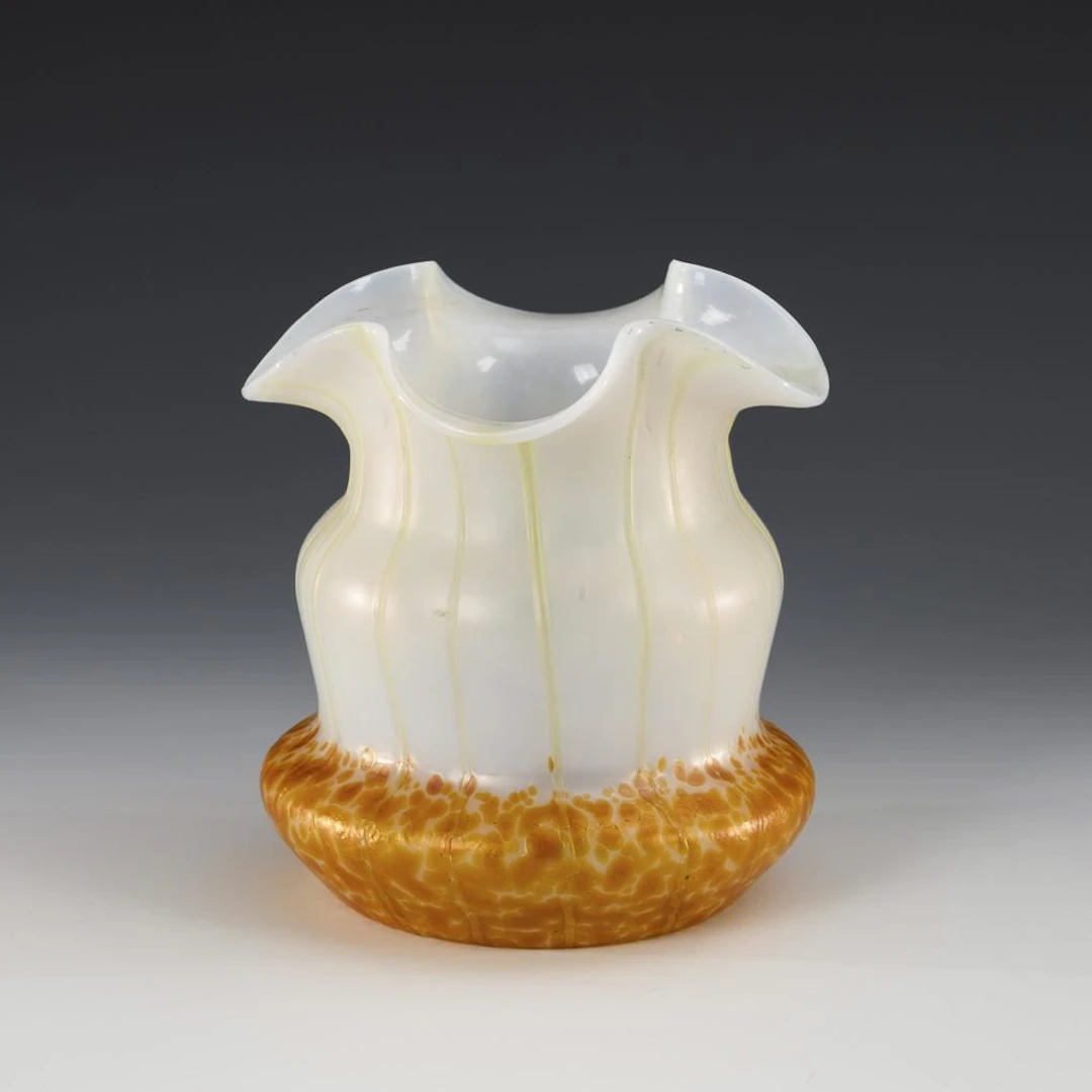 Art Nouveau vase with beads and threads.