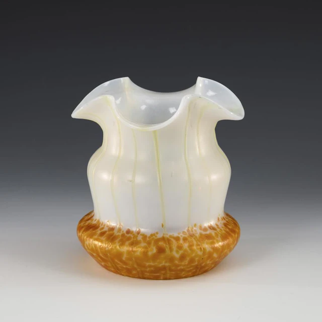 Art Nouveau vase with beads and threads.