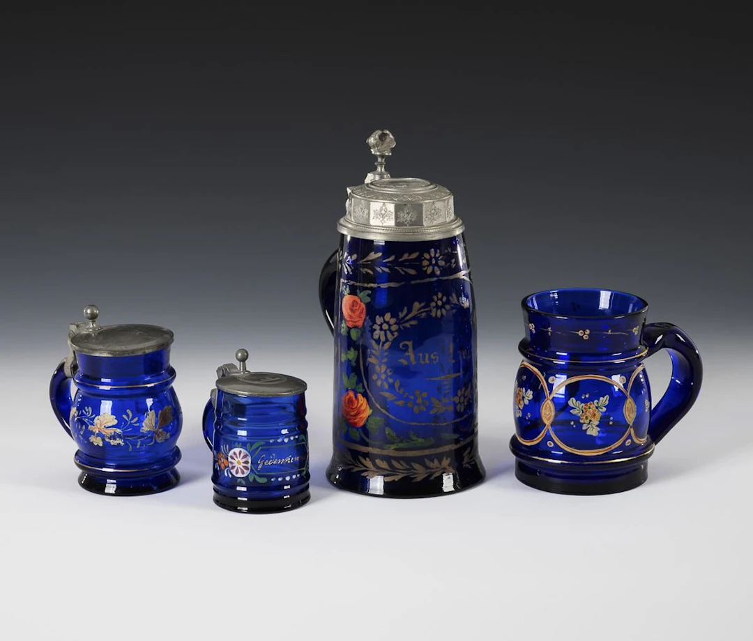 4 cobalt-blue beer mugs.