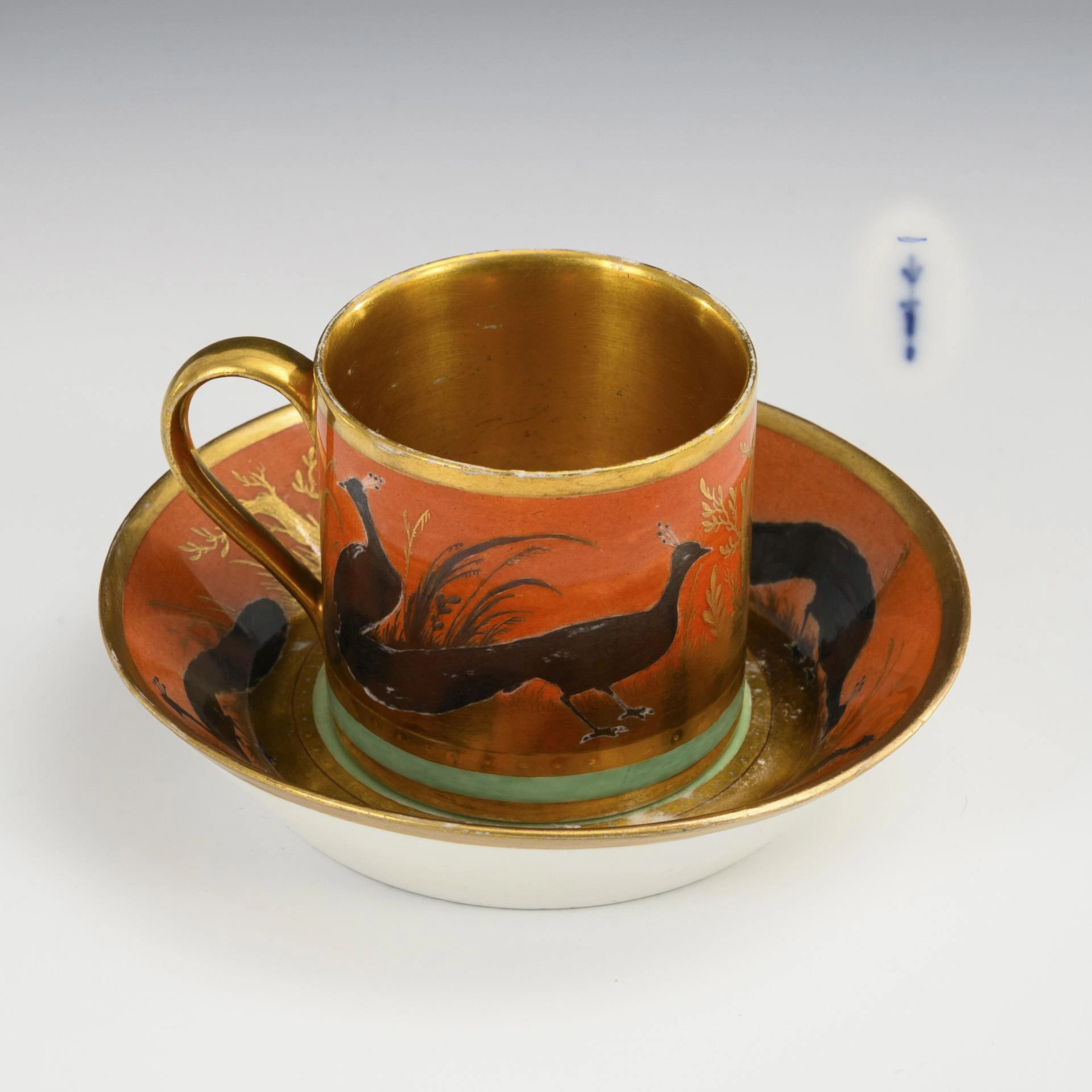 Empire vitrine cup with peacock motif. KPM Berlin.