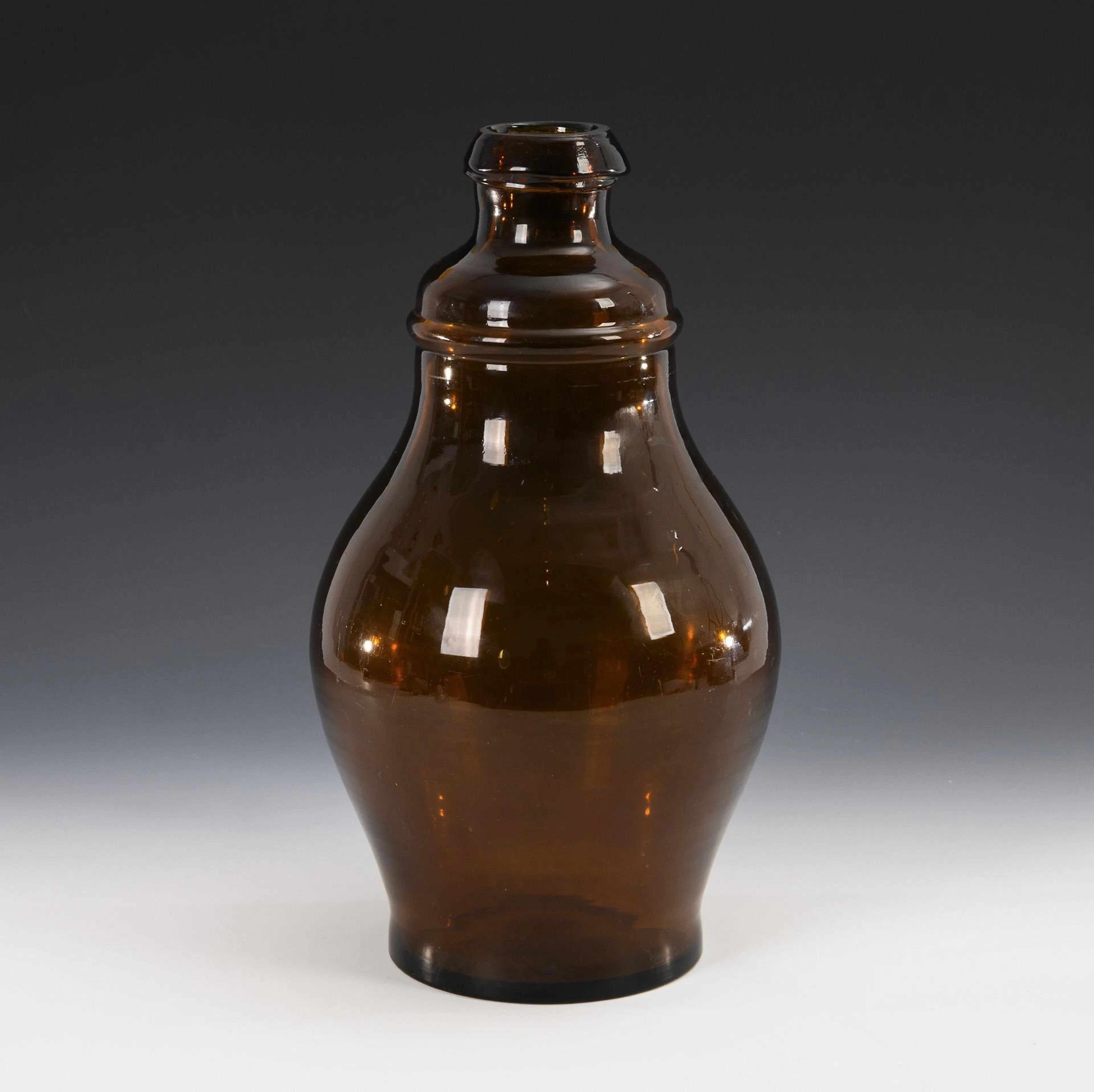 Large amber glass bottle.
