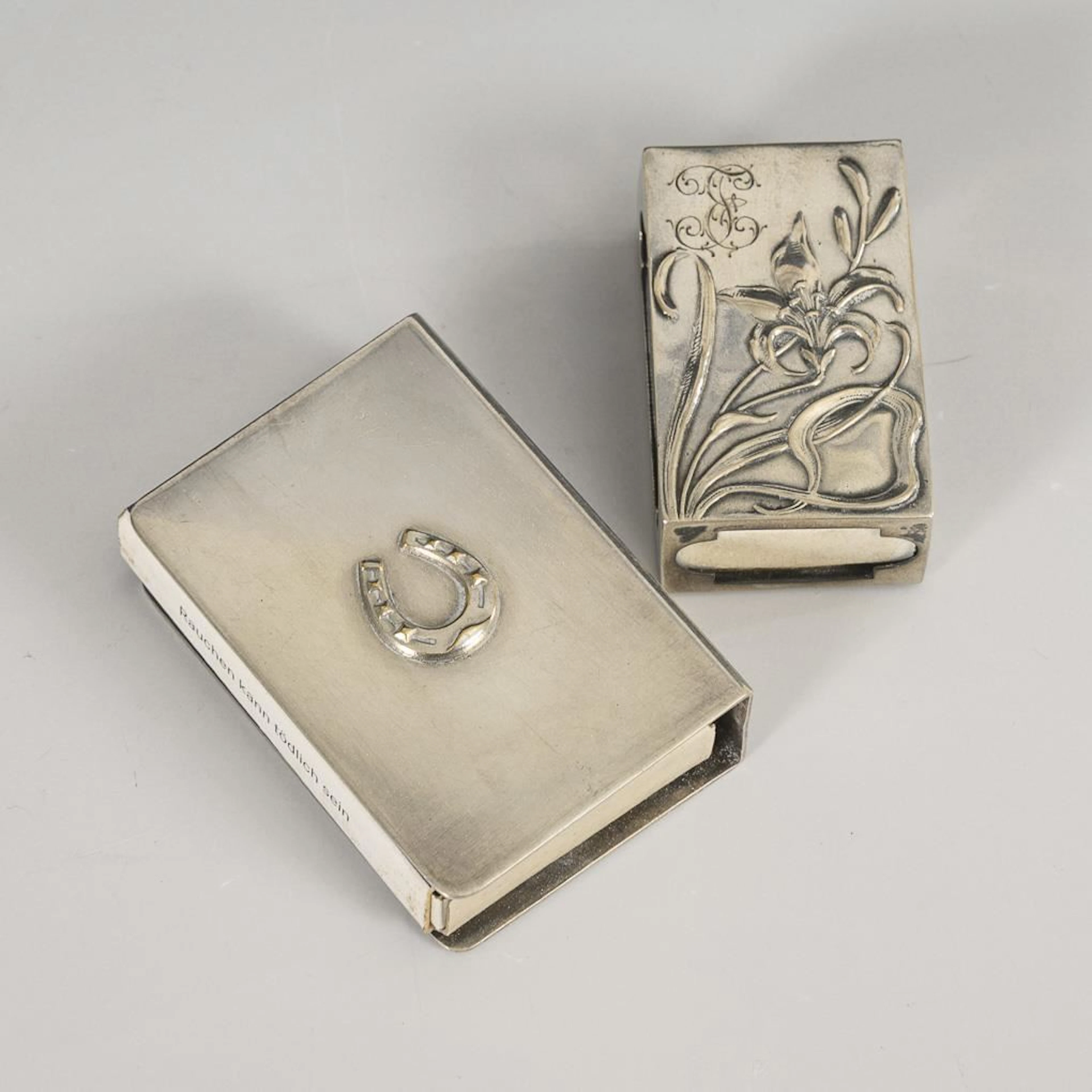 2 matchbox covers.