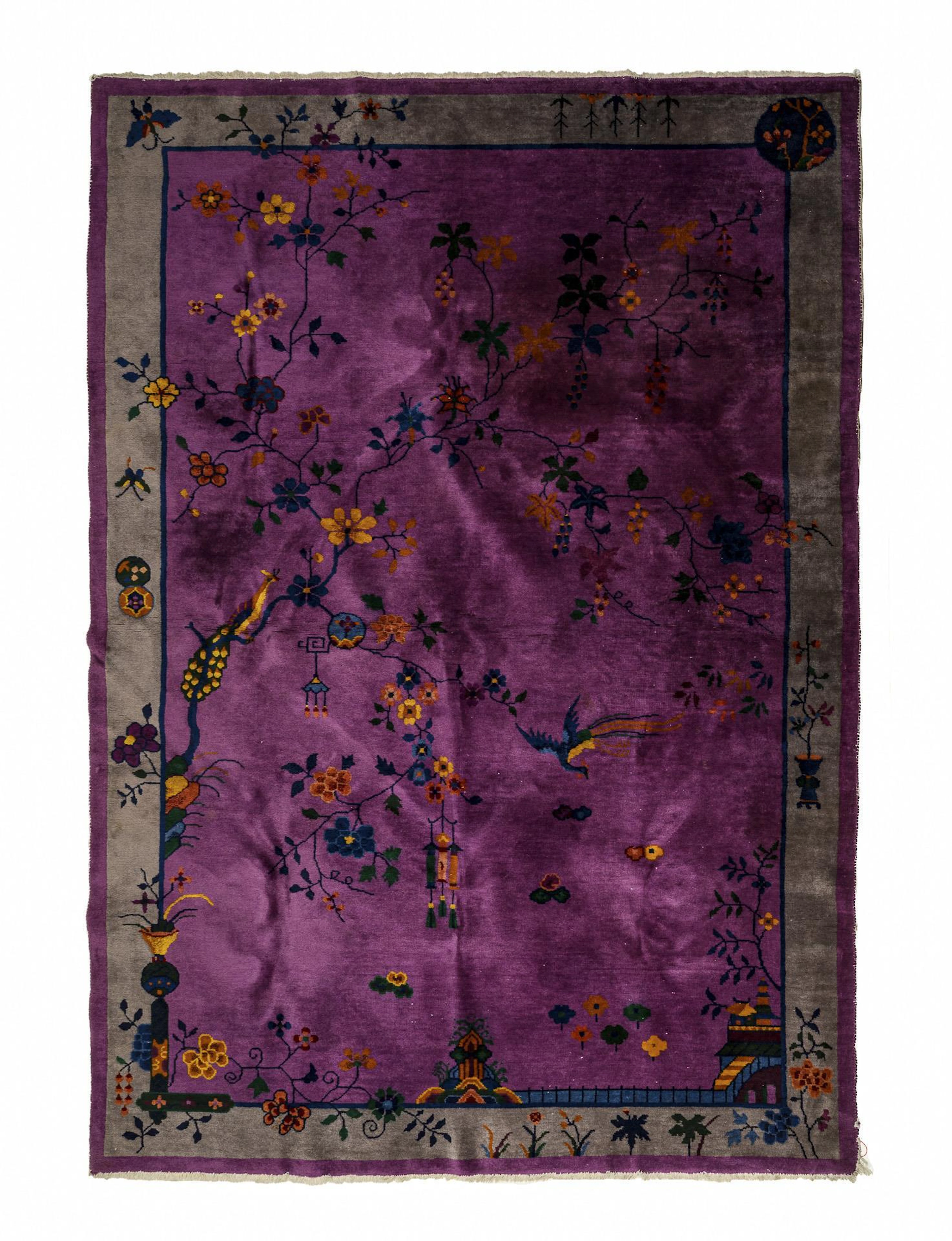 Asian carpet with flowering branches and birds.