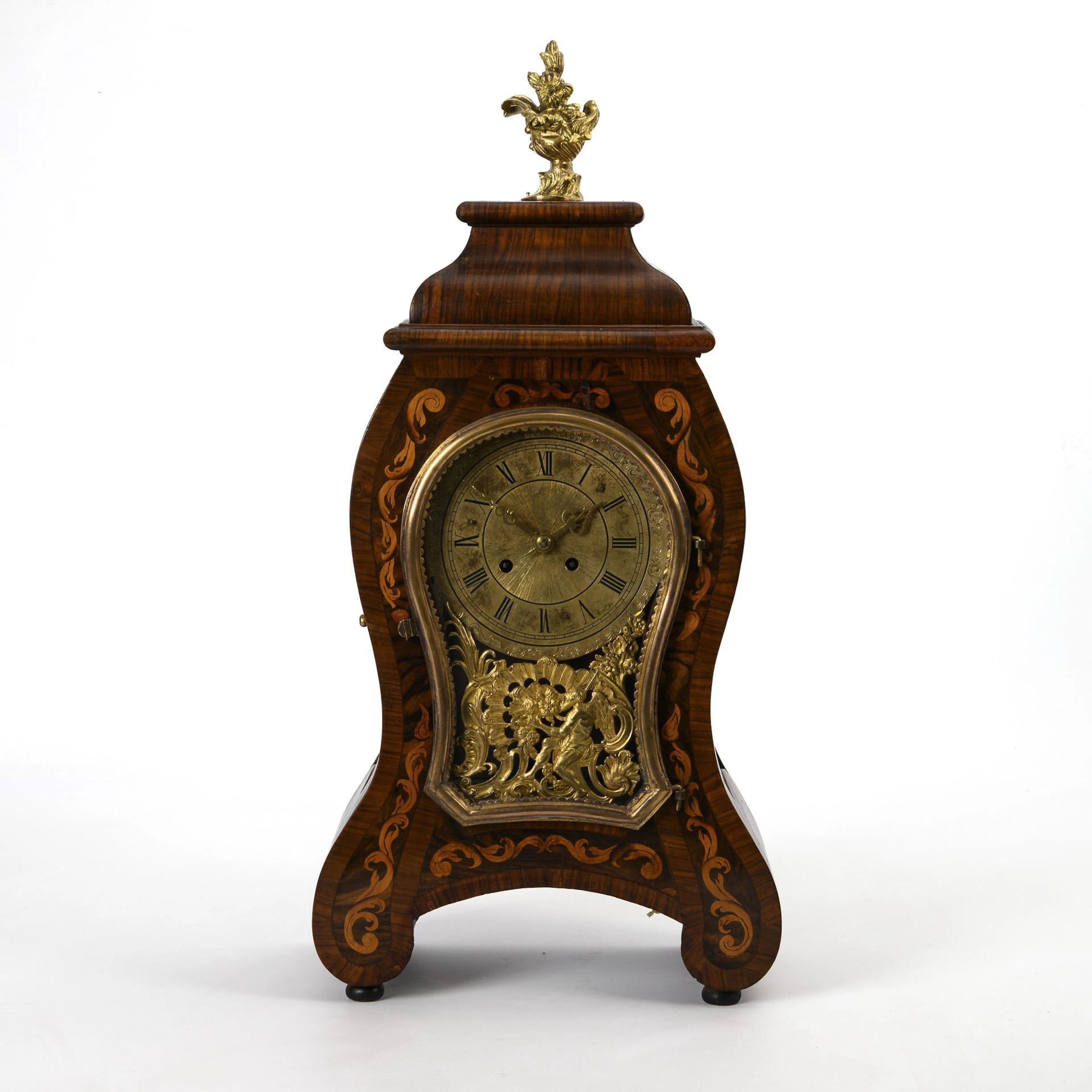 Neo-Baroque period clock with Chronos motif.
