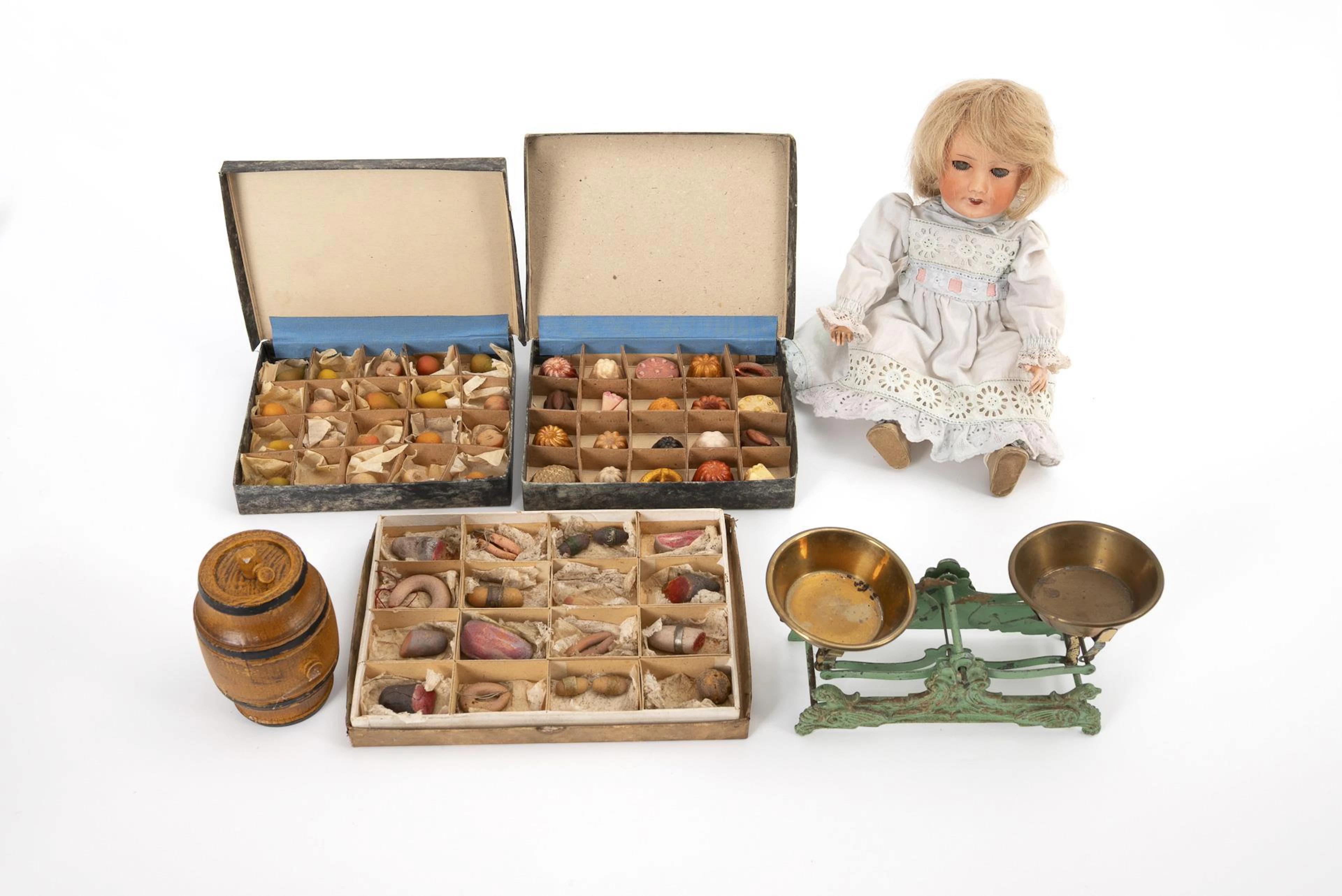 French doll, scales, wine barrel and 3 sample boxes with food for the shop.