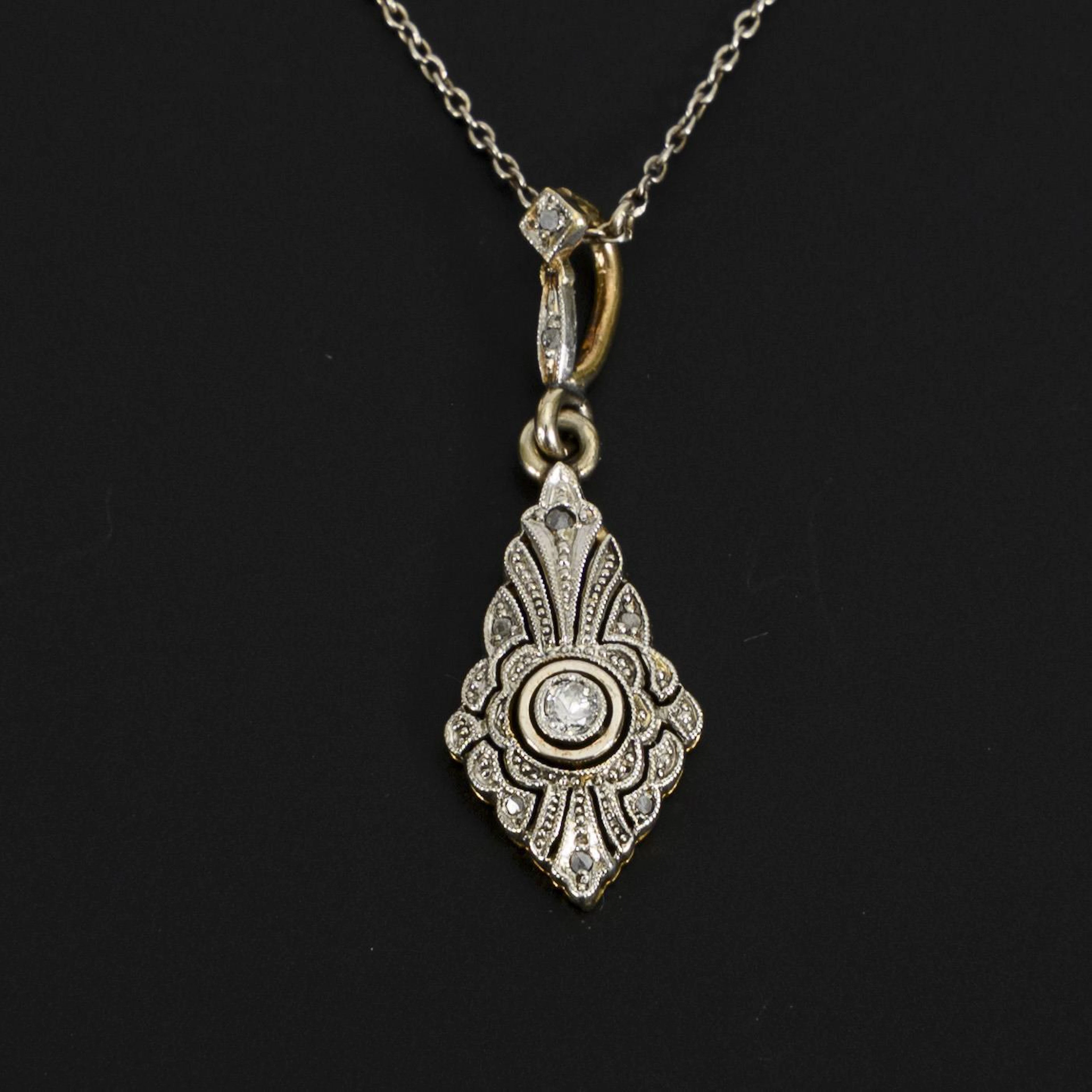 Delicate Art Deco pendant on a filigree chain.