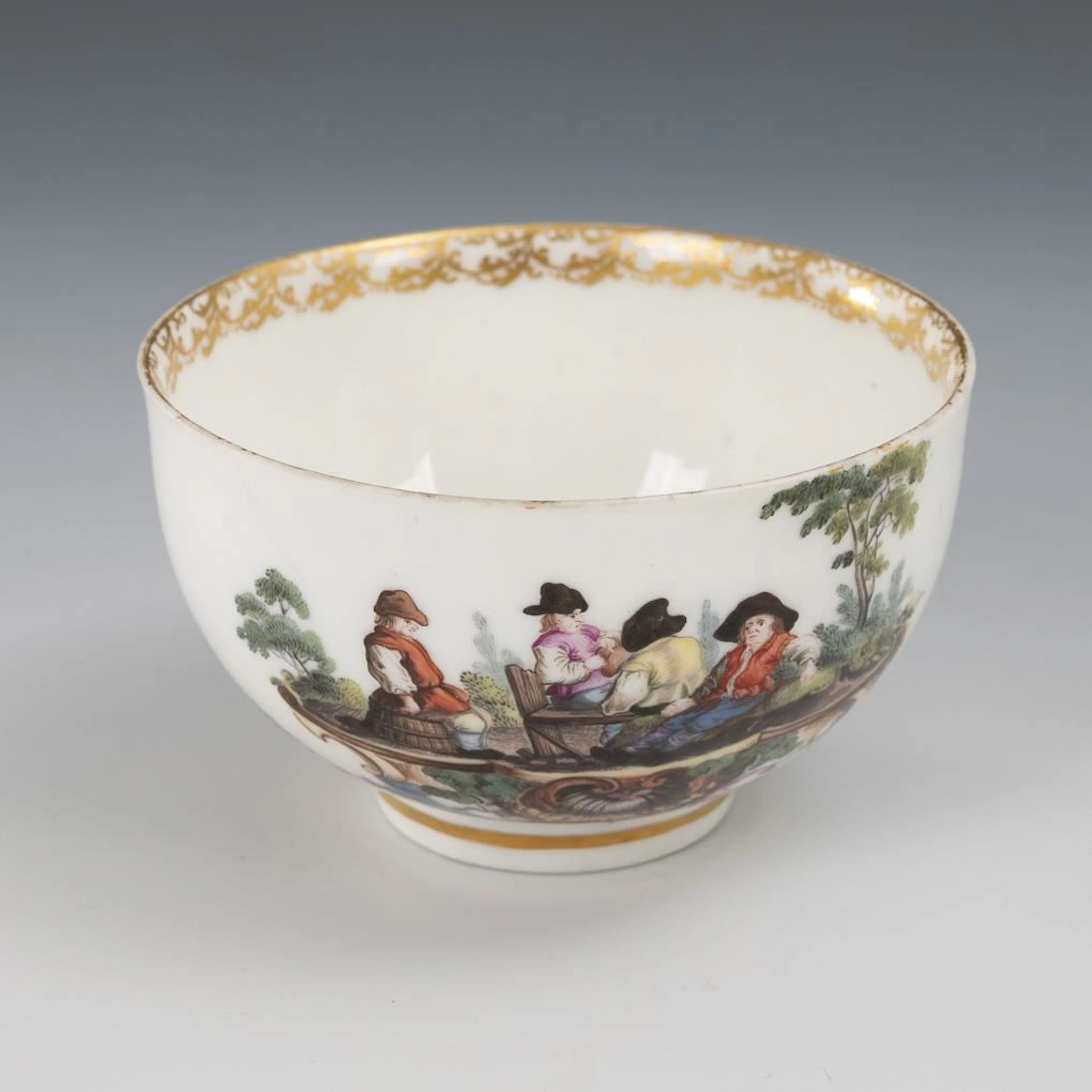 Baroque cup with a peasant motif. Meissen.