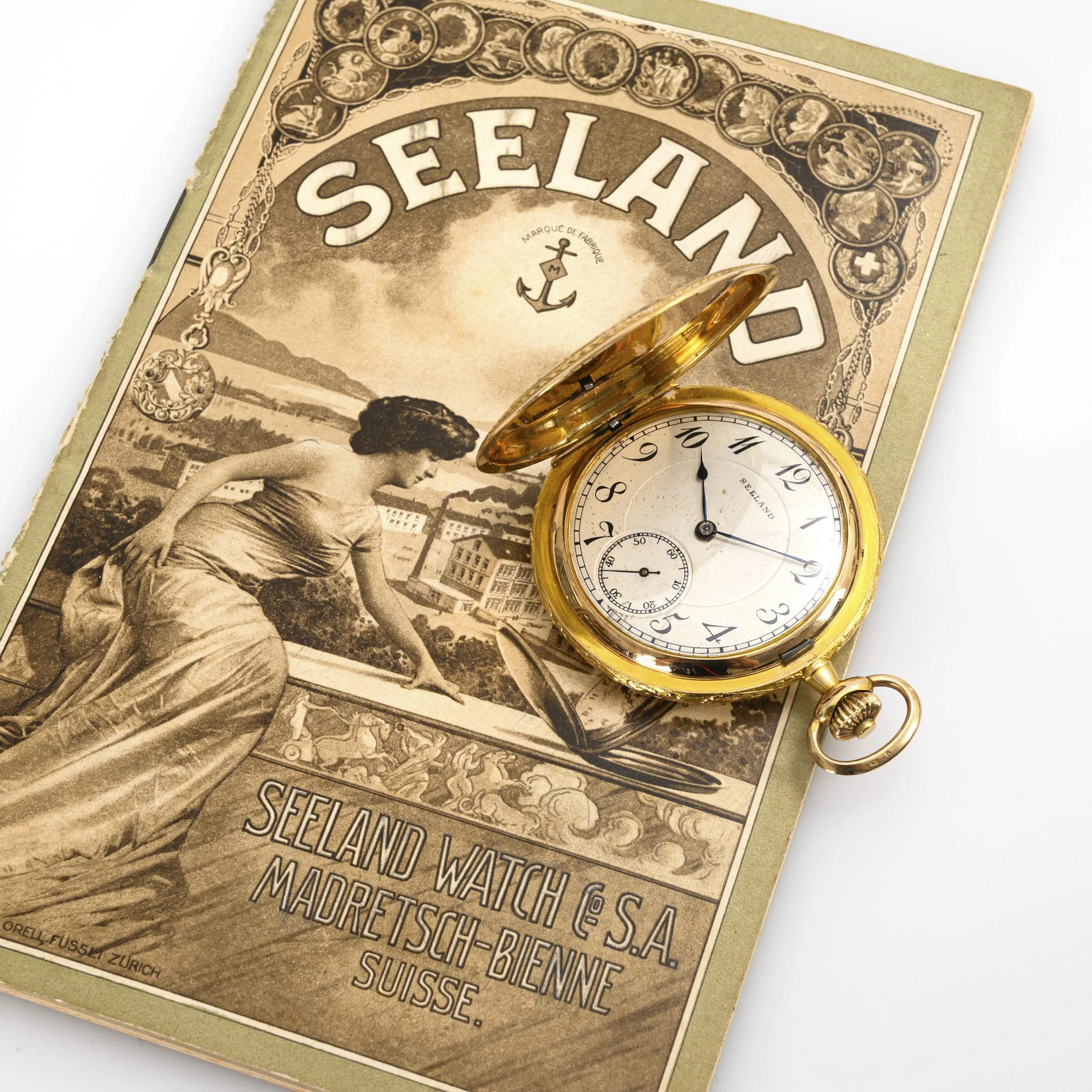 Golden Art Nouveau sprung-cap clock "Seeland". Seeland Watch Co. S.A.