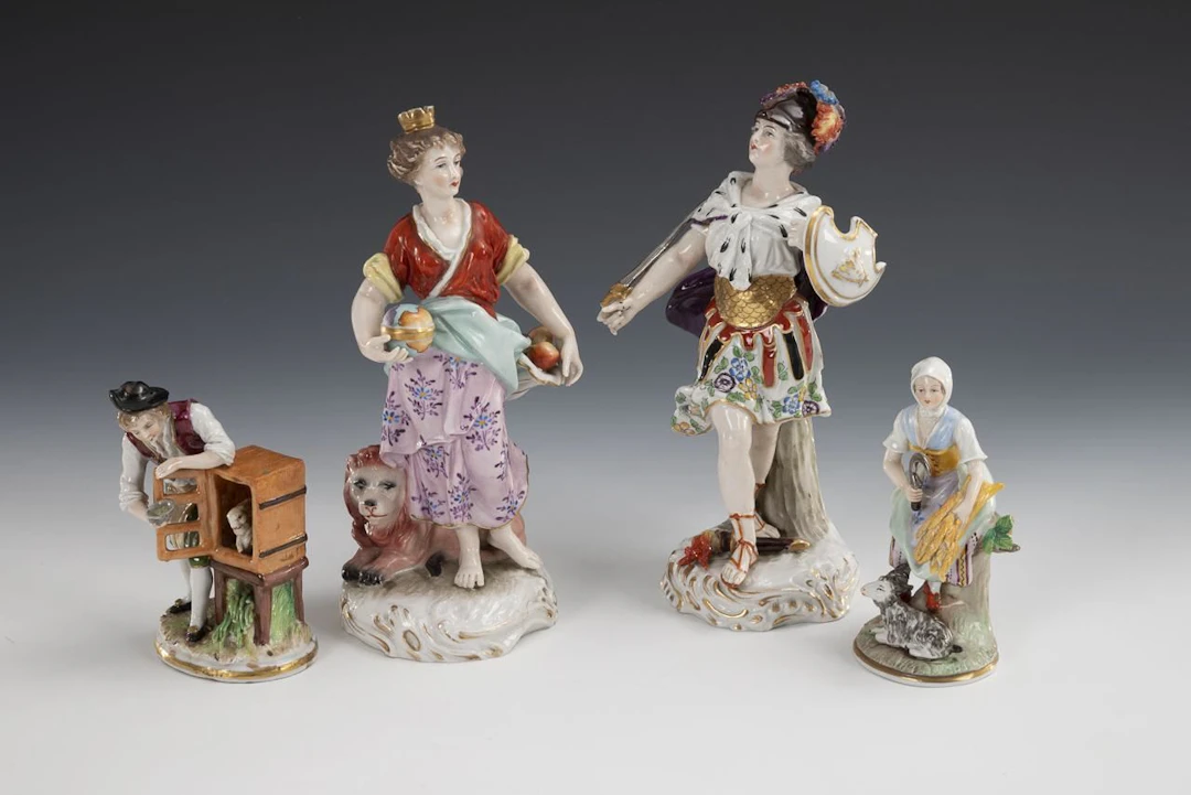 2 mythological figures and 2 peasant figures.