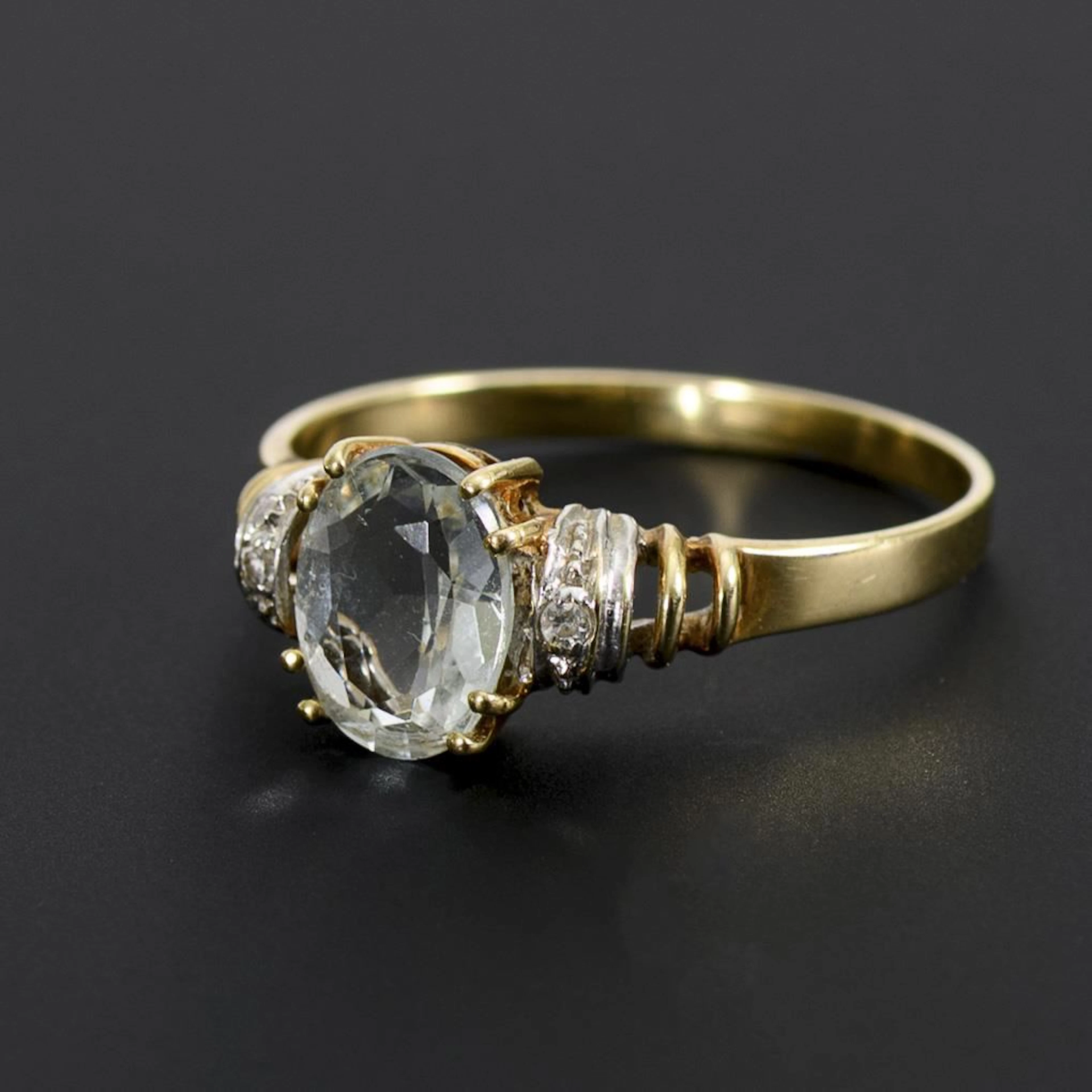 Ring with a blue gemstone.